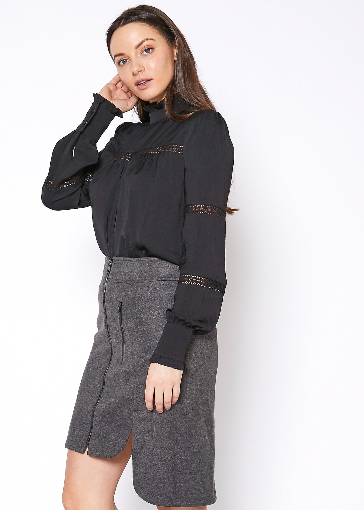 Women's Eyelet Long Sleeve Mock Neck Top featuring intricate eyelet details and a stylish back button closure.