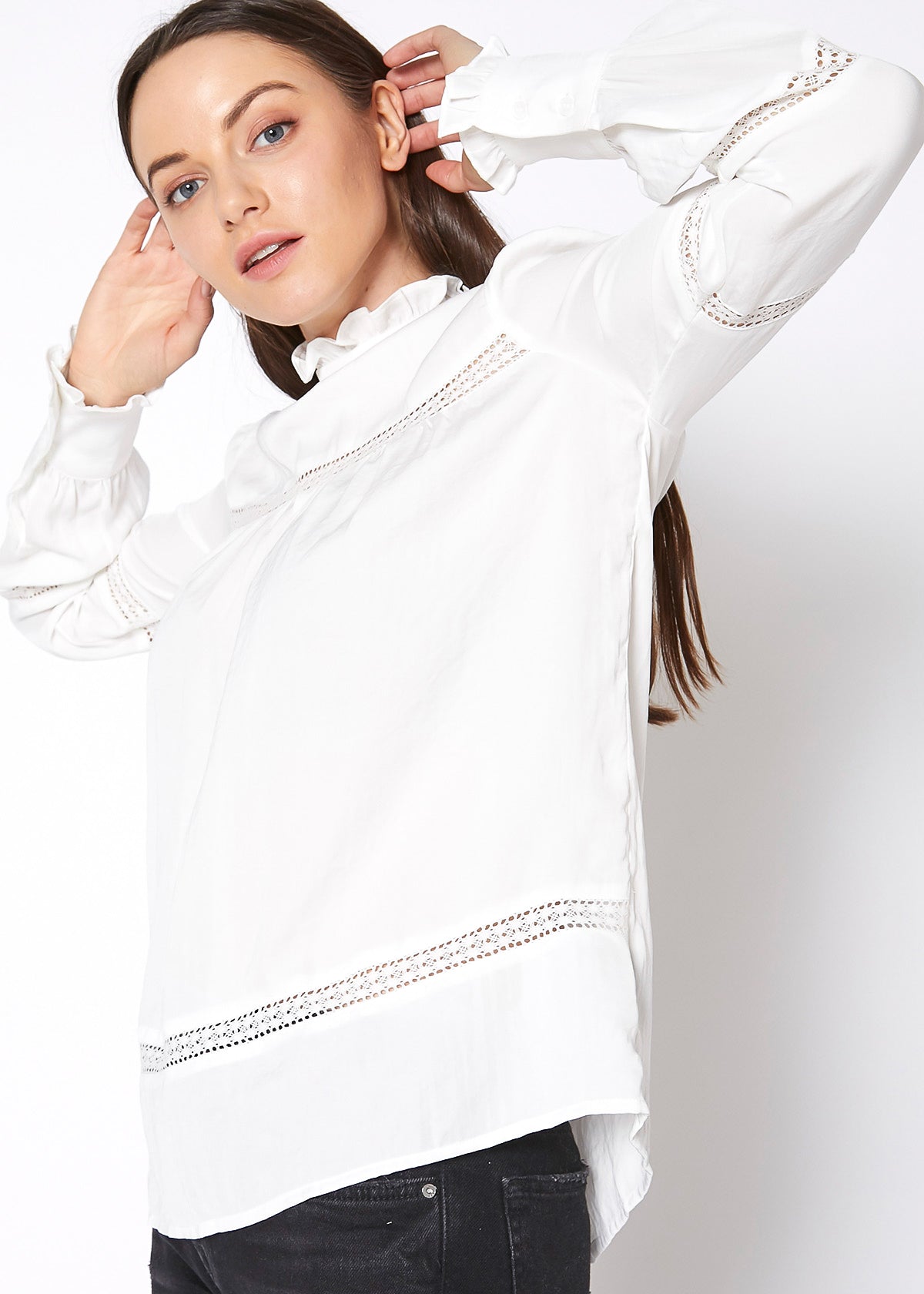 Women's Eyelet Long Sleeve Mock Neck Top featuring intricate eyelet details and a stylish back button closure.