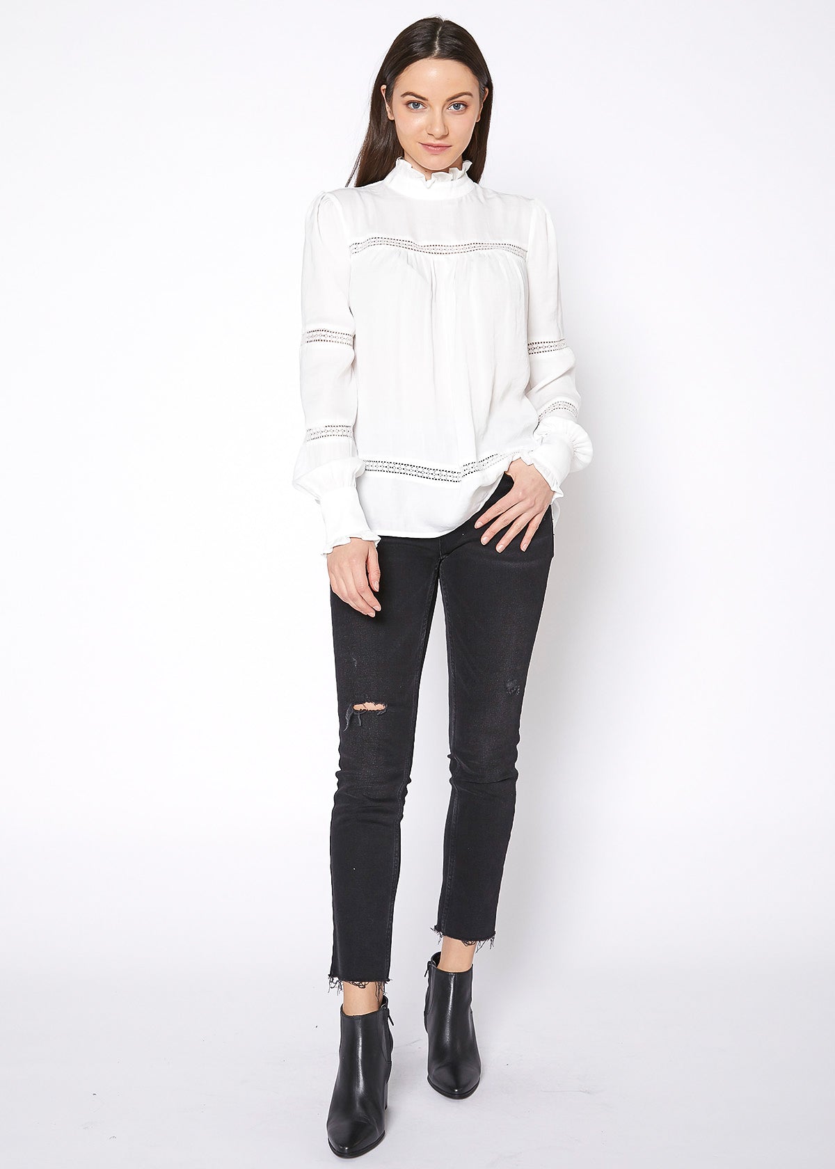 Women's Eyelet Long Sleeve Mock Neck Top featuring intricate eyelet details and a stylish back button closure.