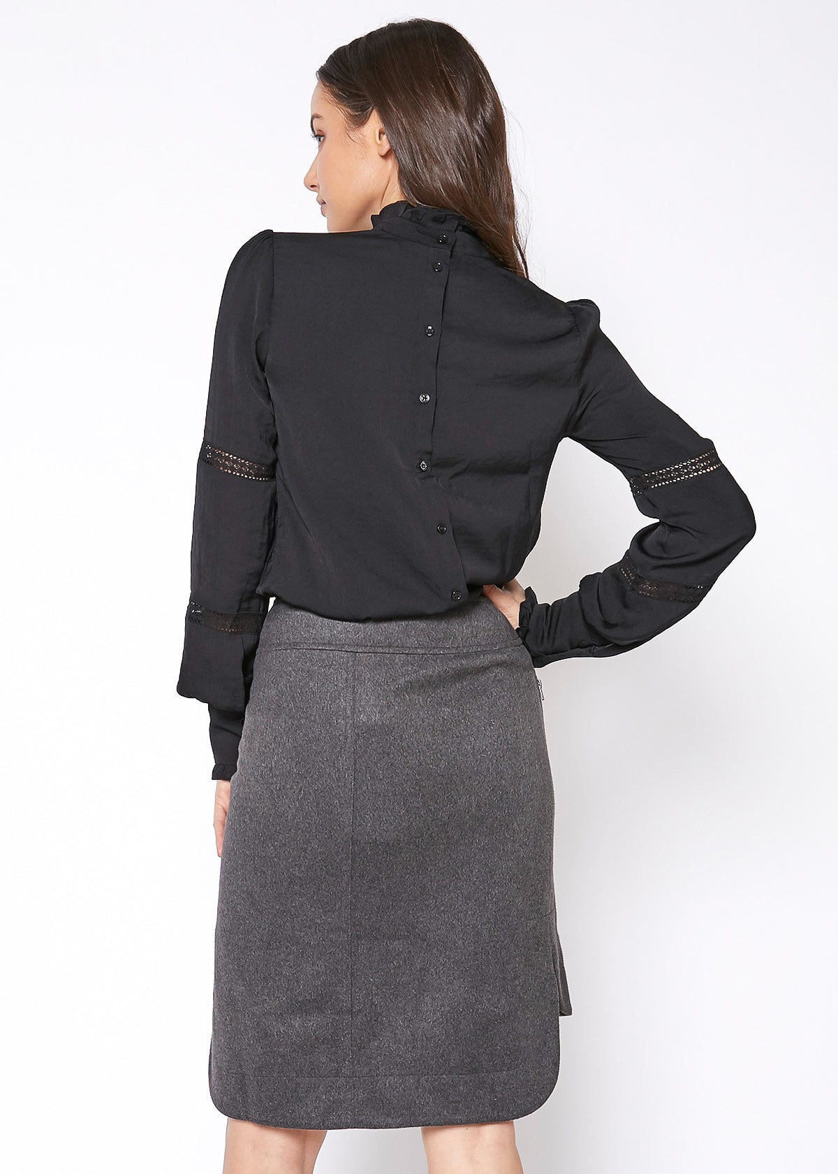 Women's Eyelet Long Sleeve Mock Neck Top featuring intricate eyelet details and a stylish back button closure.