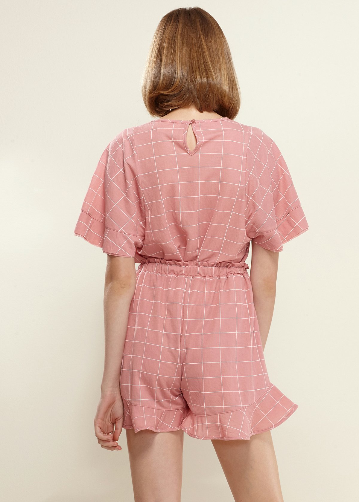 Women's Grid Print Blouse in soft pink with butterfly sleeves and round neckline, featuring a stylish grid pattern.