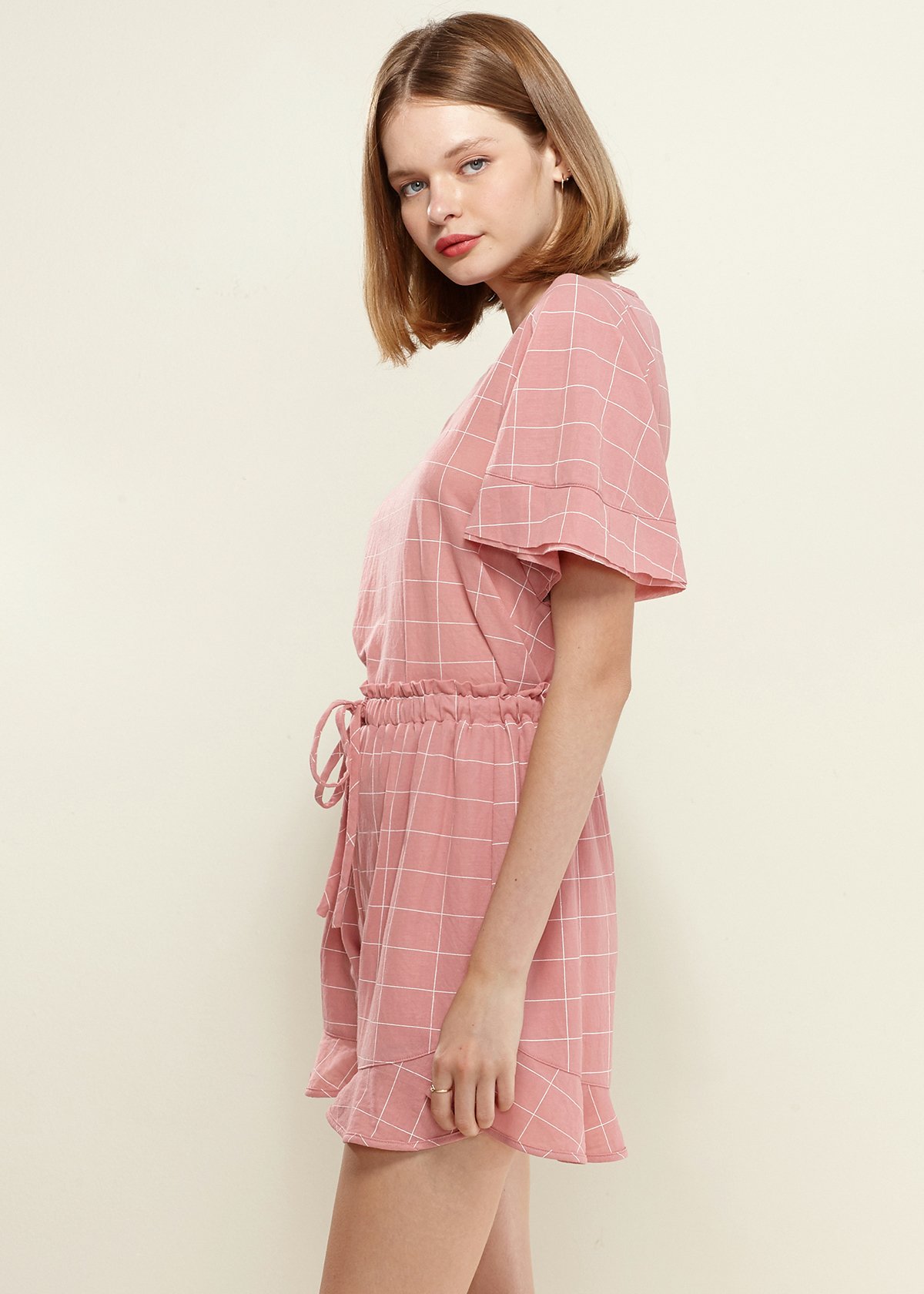 Women's Grid Print Blouse in soft pink with butterfly sleeves and round neckline, featuring a stylish grid pattern.