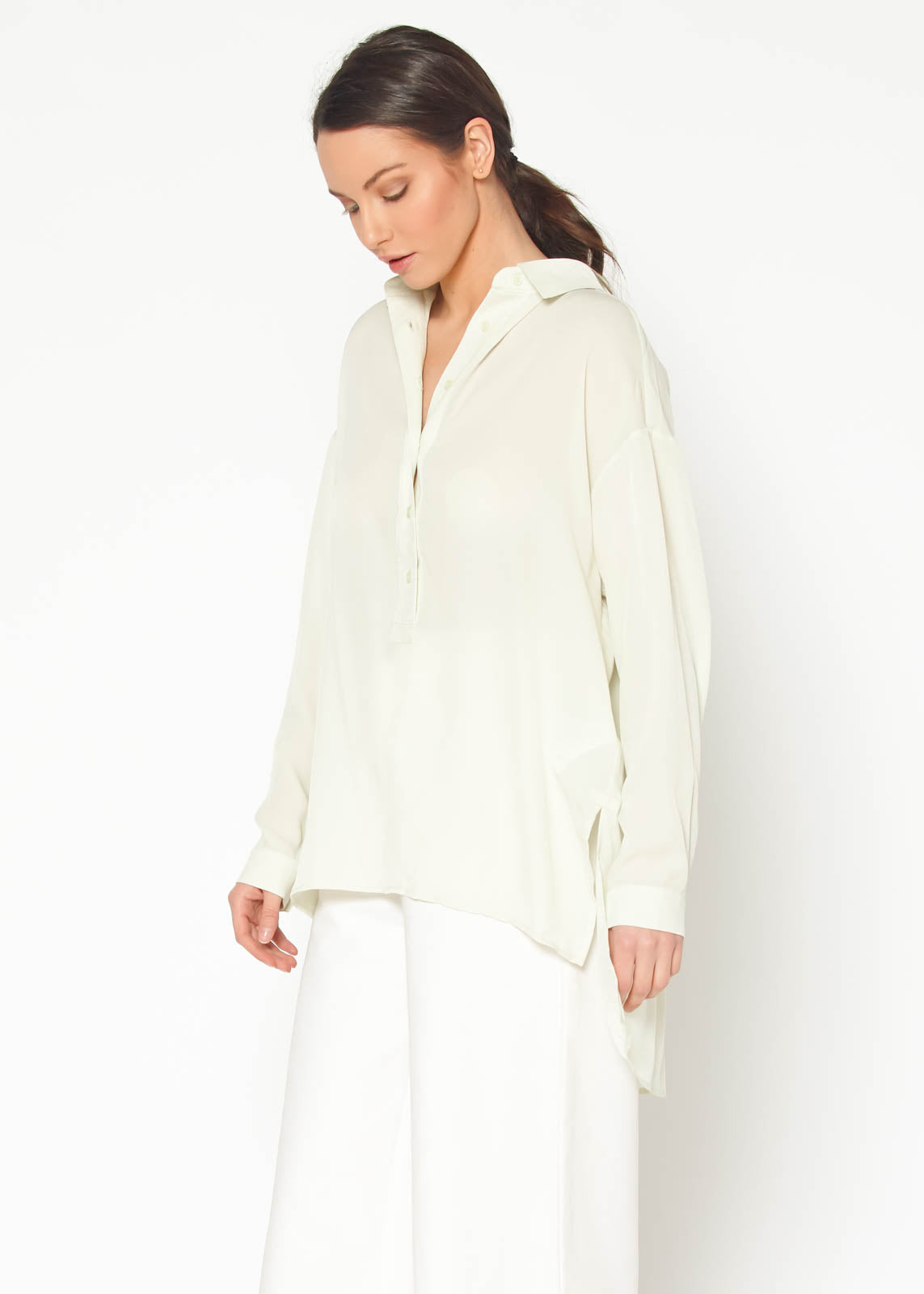 Women's Hi Lo Button Up Shirt Blouse featuring a pleated back and oversized fit, made from 100% polyester.