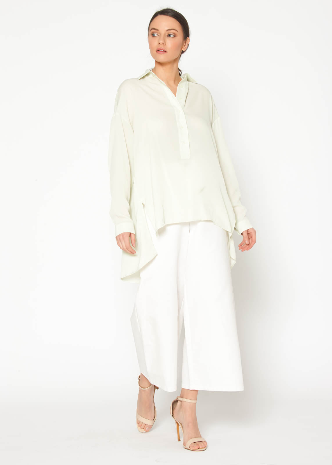 Women's Hi Lo Button Up Shirt Blouse featuring a pleated back and oversized fit, made from 100% polyester.