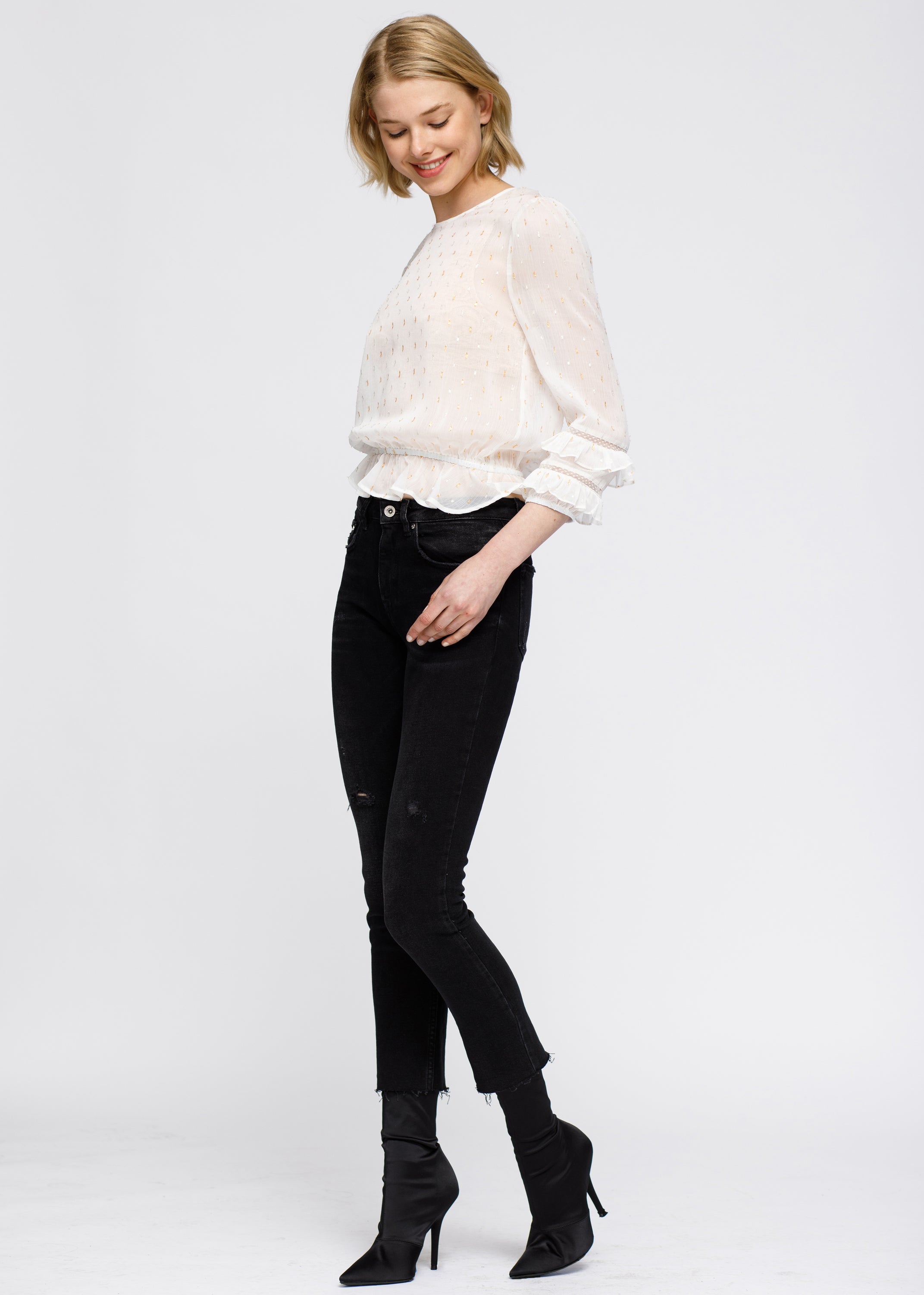 Women's white blouse featuring delicate lace inset and ruffle details, perfect for stylish occasions.