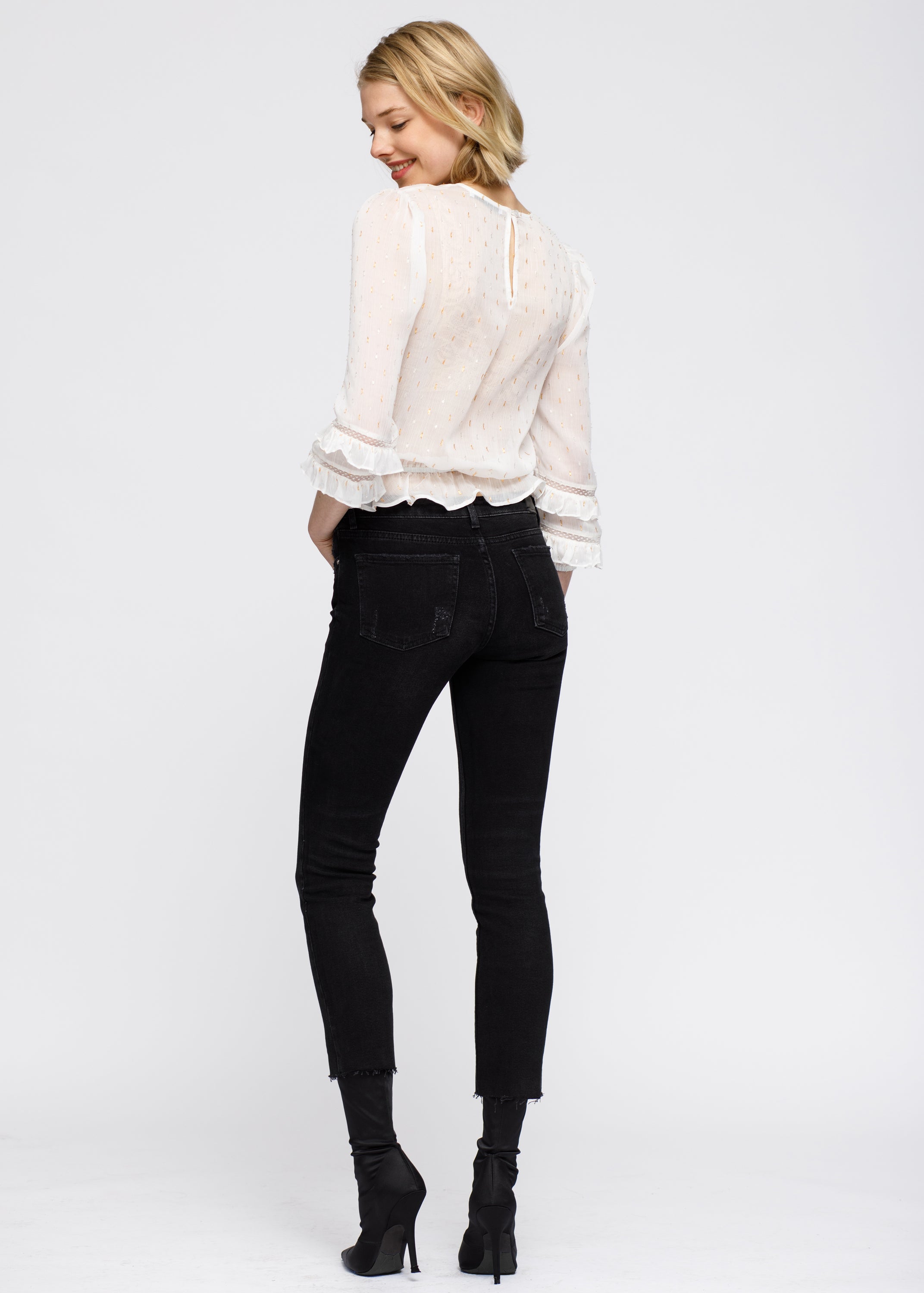 Women's white blouse featuring delicate lace inset and ruffle details, perfect for stylish occasions.