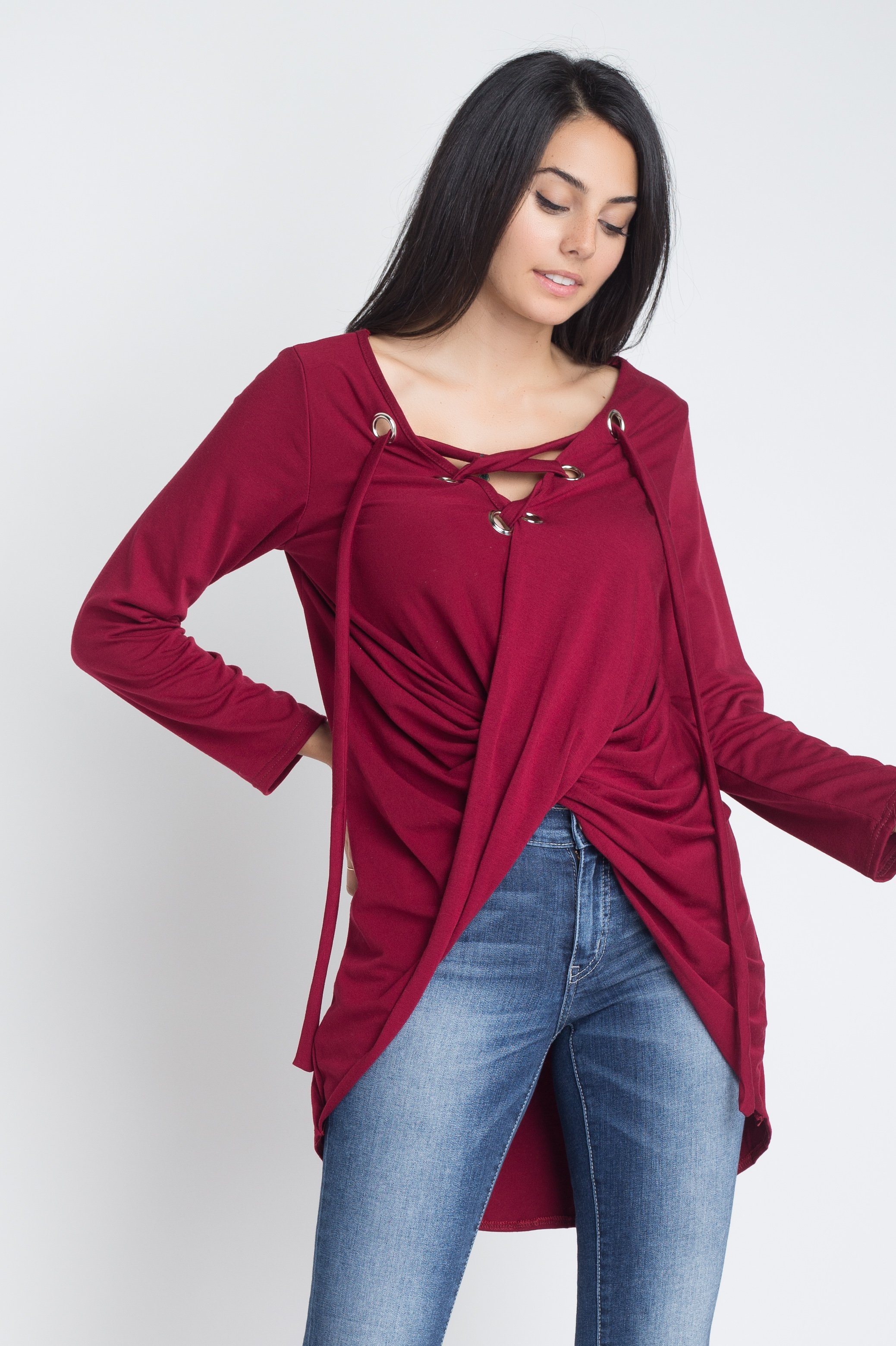 Women's long sleeve top with lace-up neckline and wrap front design, showcasing a stylish and elegant look.