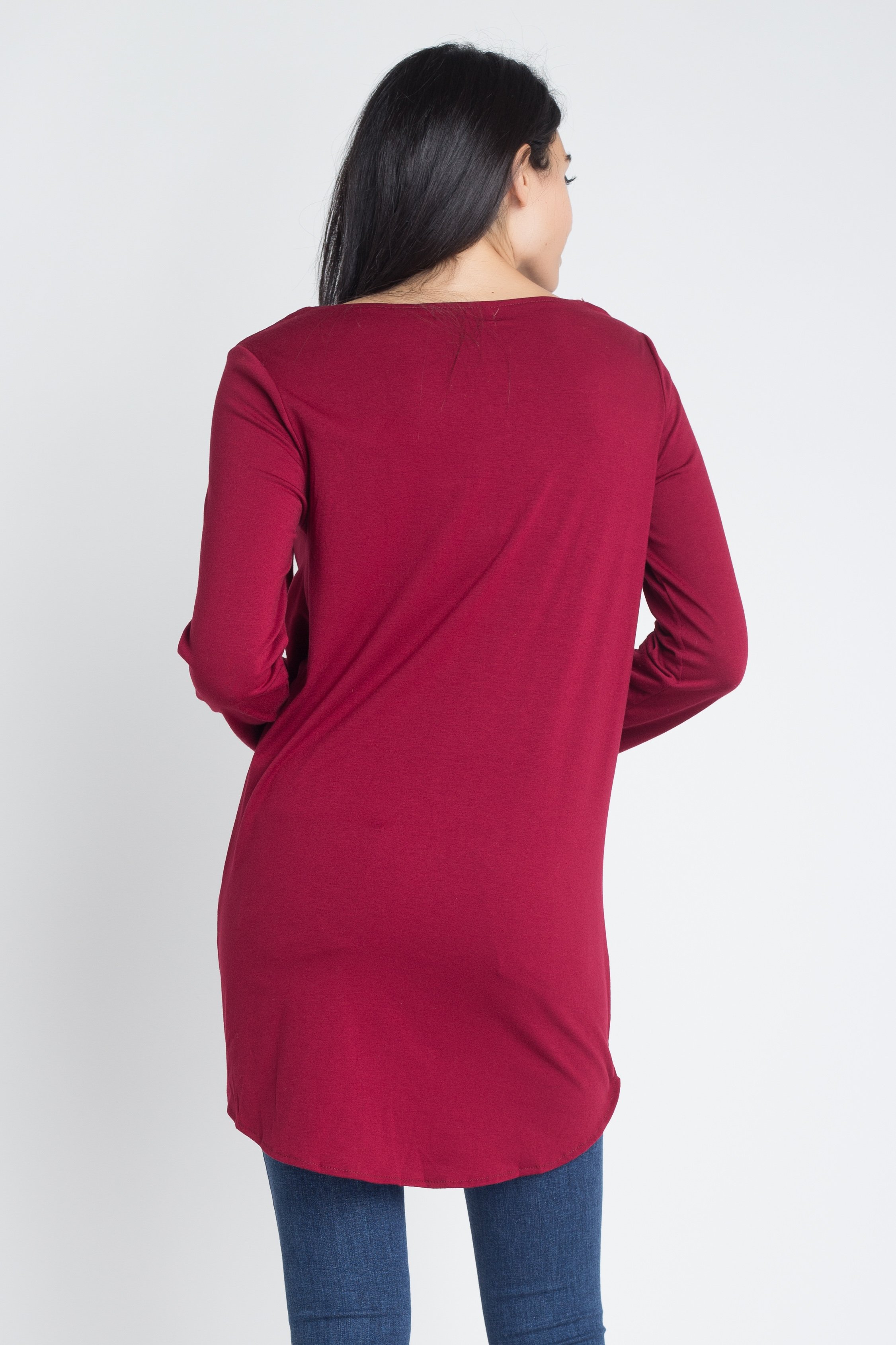 Women's long sleeve top with lace-up neckline and wrap front design, showcasing a stylish and elegant look.