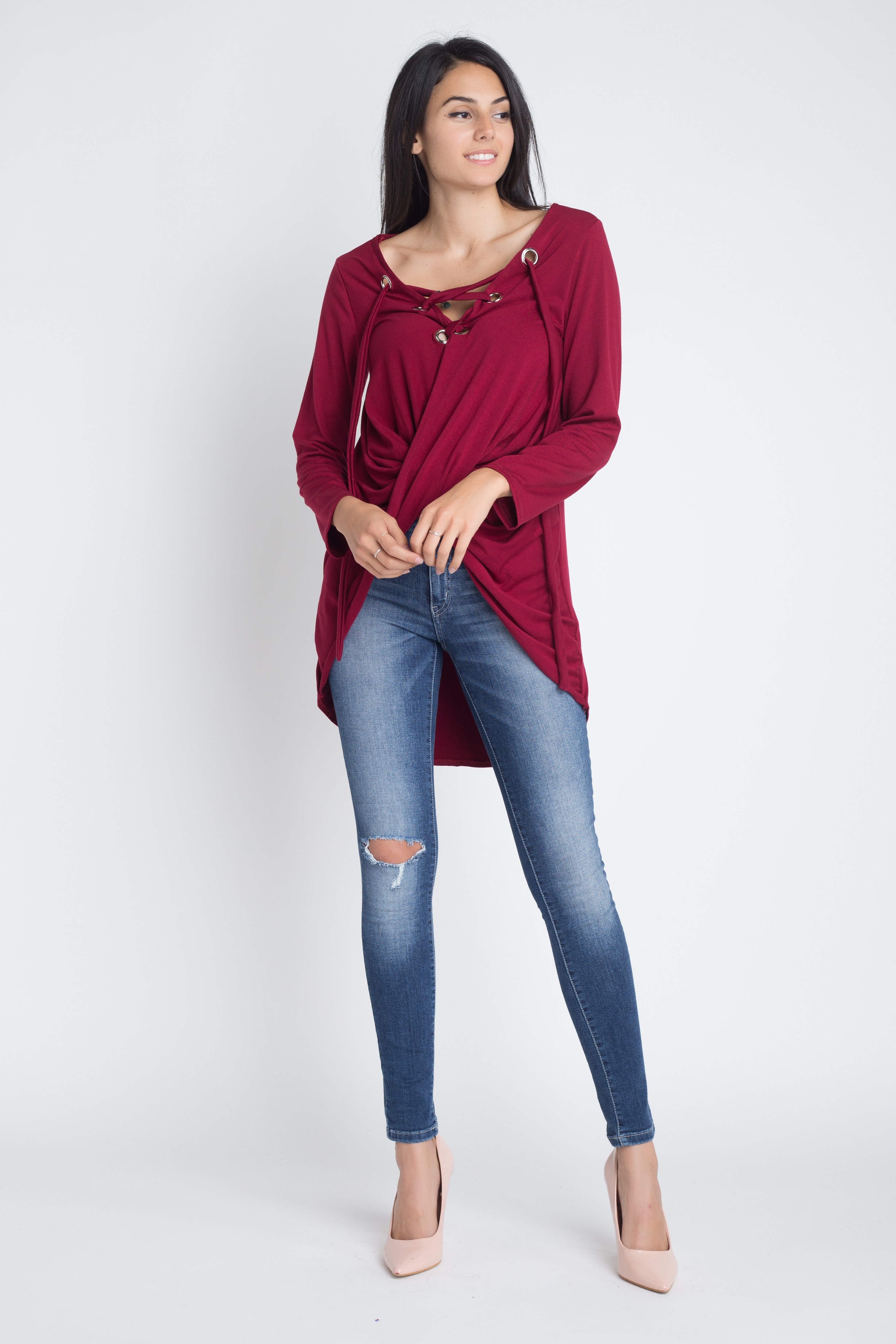 Women's long sleeve top with lace-up neckline and wrap front design, showcasing a stylish and elegant look.