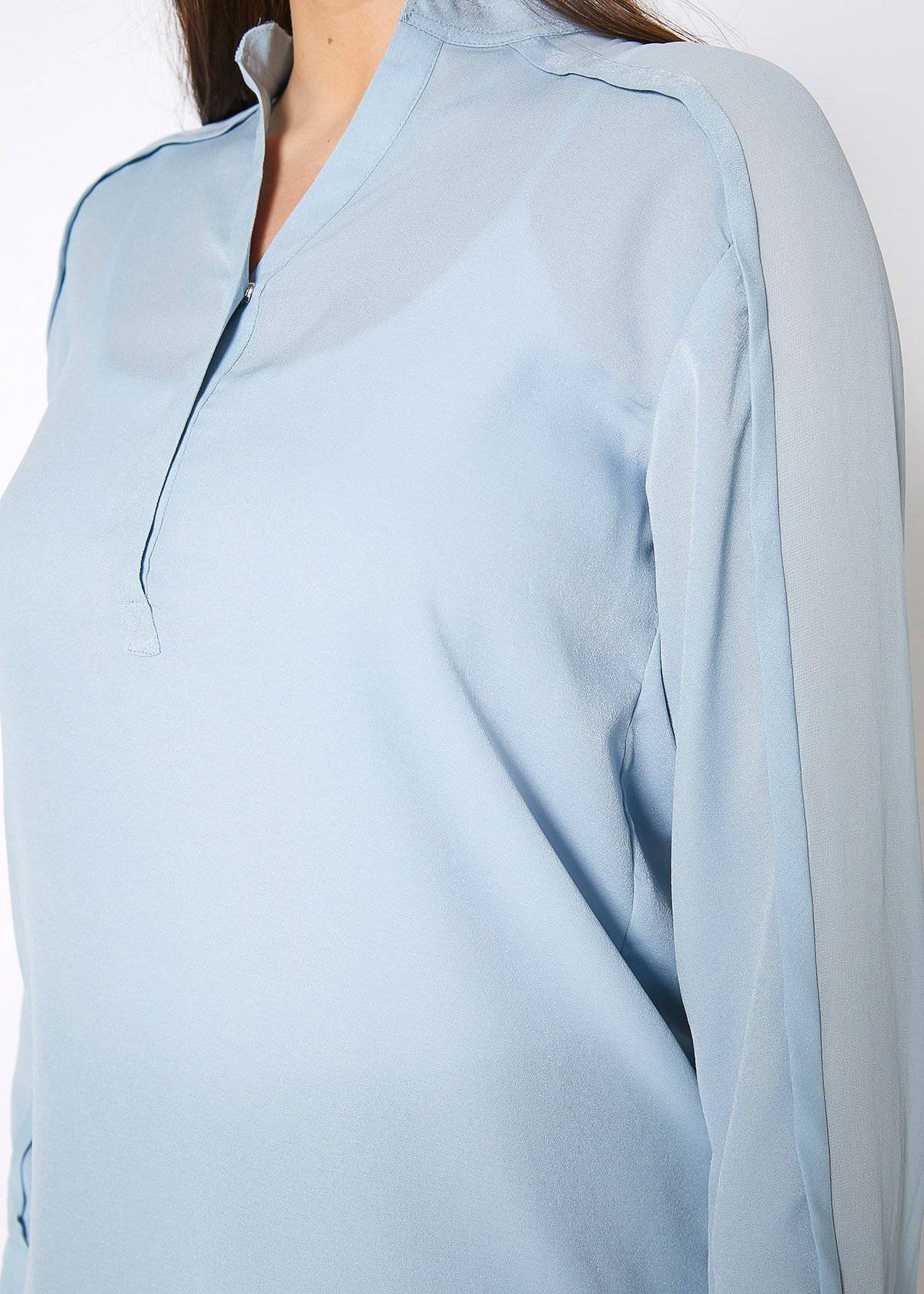 Women's mandarin collar shirt blouse in cashmere blue, featuring long sleeves and a sophisticated design.