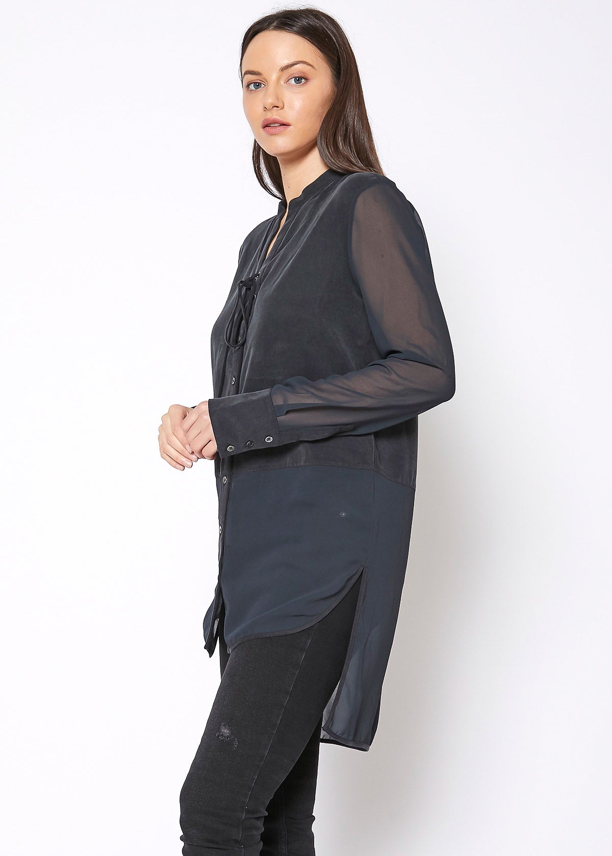 Women's black button-up shirt with sheer mesh sleeves and hem, showcasing a stylish and casual design.