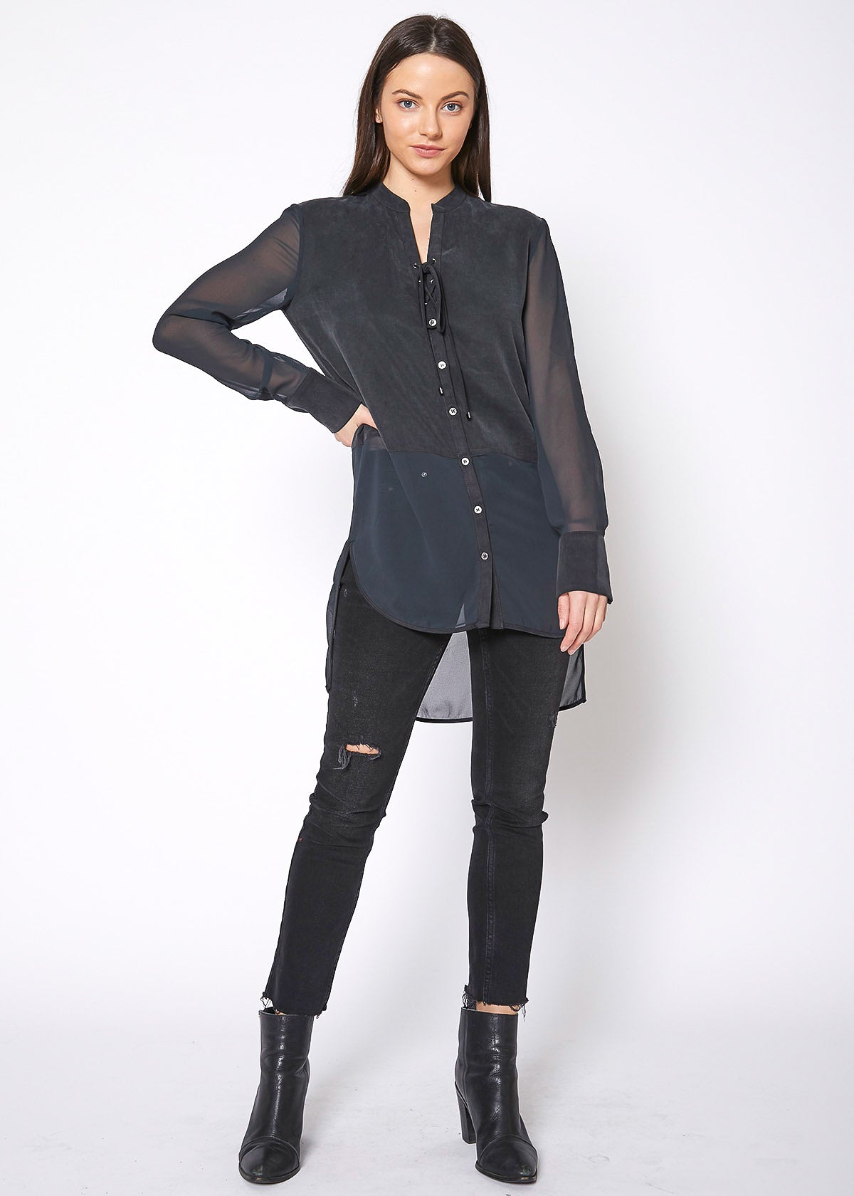 Women's black button-up shirt with sheer mesh sleeves and hem, showcasing a stylish and casual design.