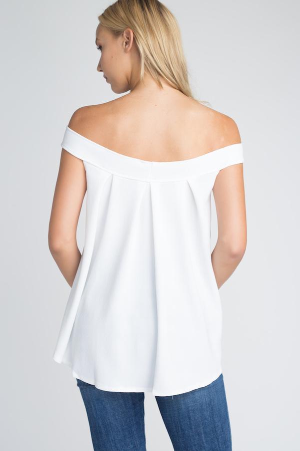 A stylish Women's Off Shoulder Flow Top in a flowy fit, showcasing its off-shoulder design and comfortable silhouette.