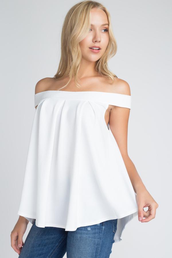 A stylish Women's Off Shoulder Flow Top in a flowy fit, showcasing its off-shoulder design and comfortable silhouette.