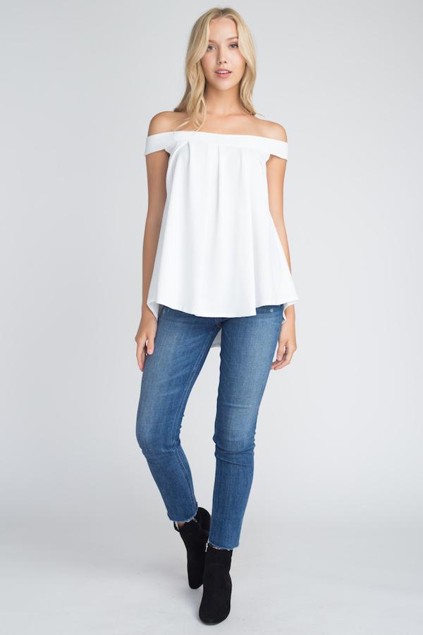 A stylish Women's Off Shoulder Flow Top in a flowy fit, showcasing its off-shoulder design and comfortable silhouette.