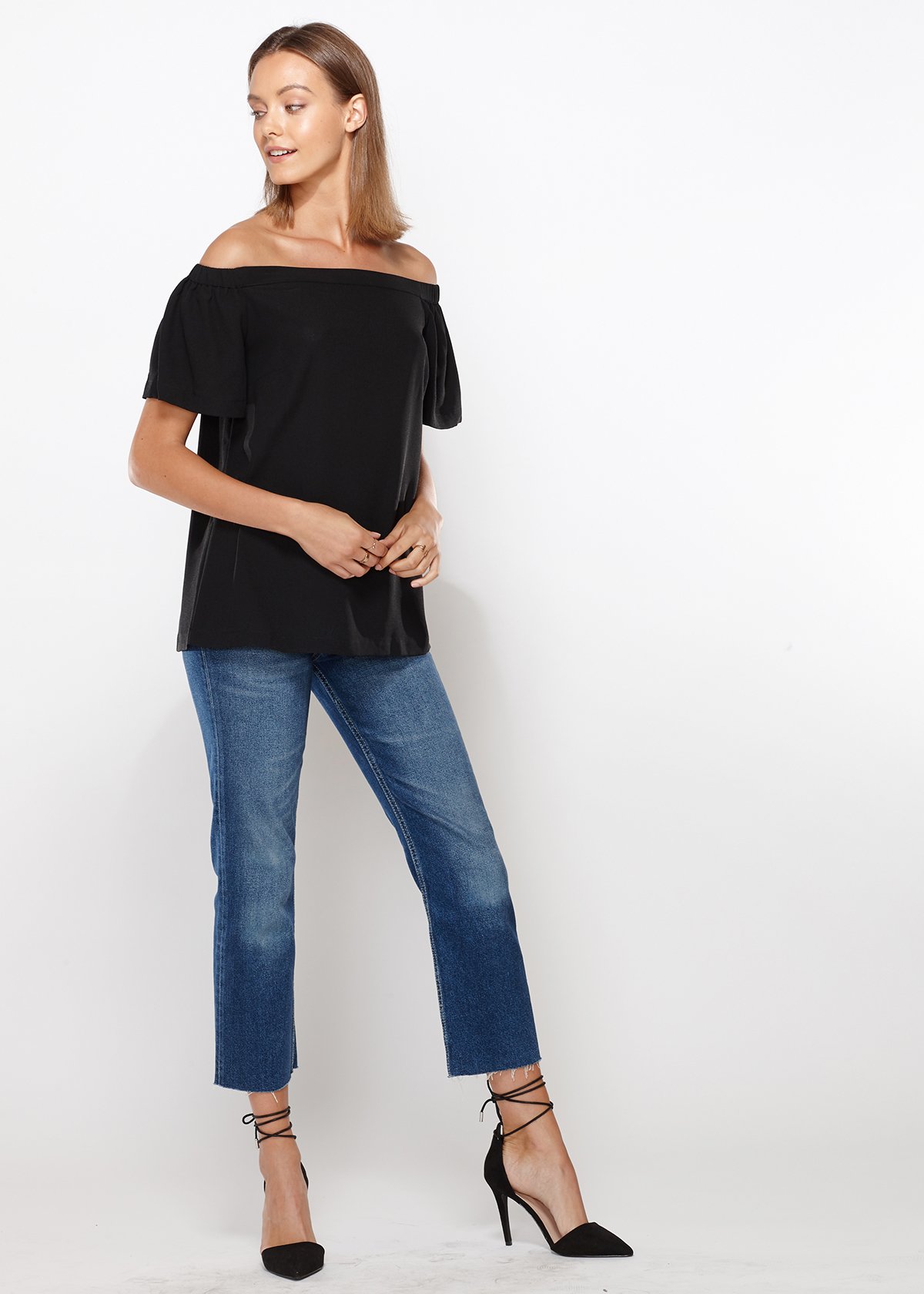 A stylish black women's off-shoulder top featuring short bell sleeves and an elasticized shoulder line, perfect for casual and formal occasions.