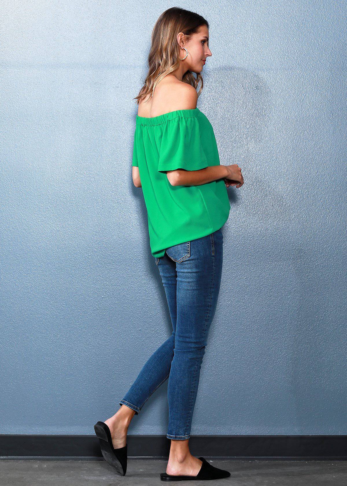 A stylish women's off-shoulder top in green with short bell sleeves and an elasticized shoulder line, perfect for casual outings.