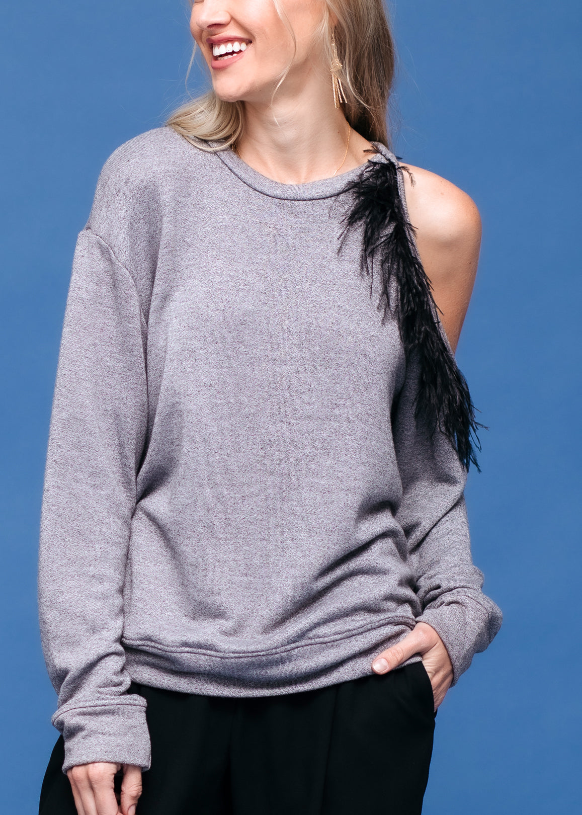 A stylish Women's One Shoulder Feather Sweatshirt featuring a trendy one-shoulder design, made from soft polyester and rayon blend fabric.