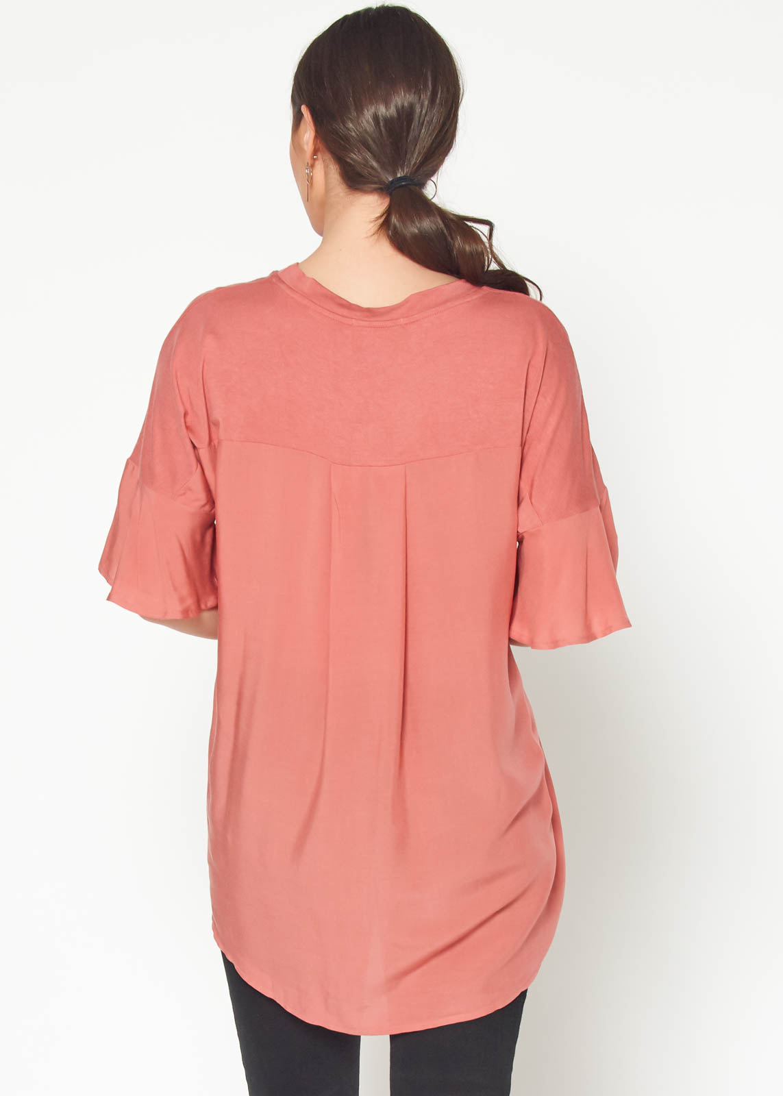 Women's oversized basic tunic top in terracotta, showcasing a relaxed fit and soft fabric.