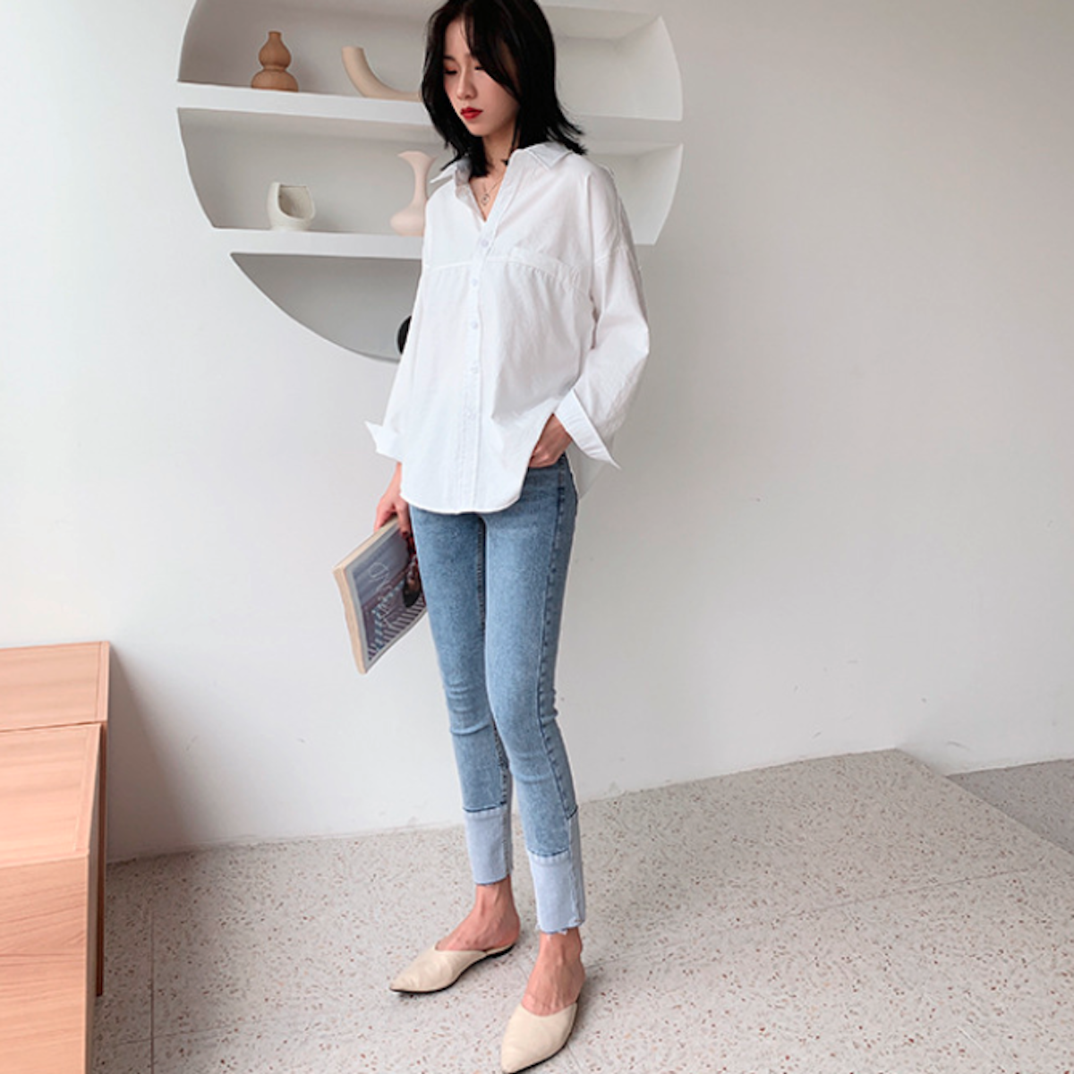 Womens Relaxed Fit Longline Shirt in white, showcasing long sleeves and loose fit design, perfect for casual street fashion.