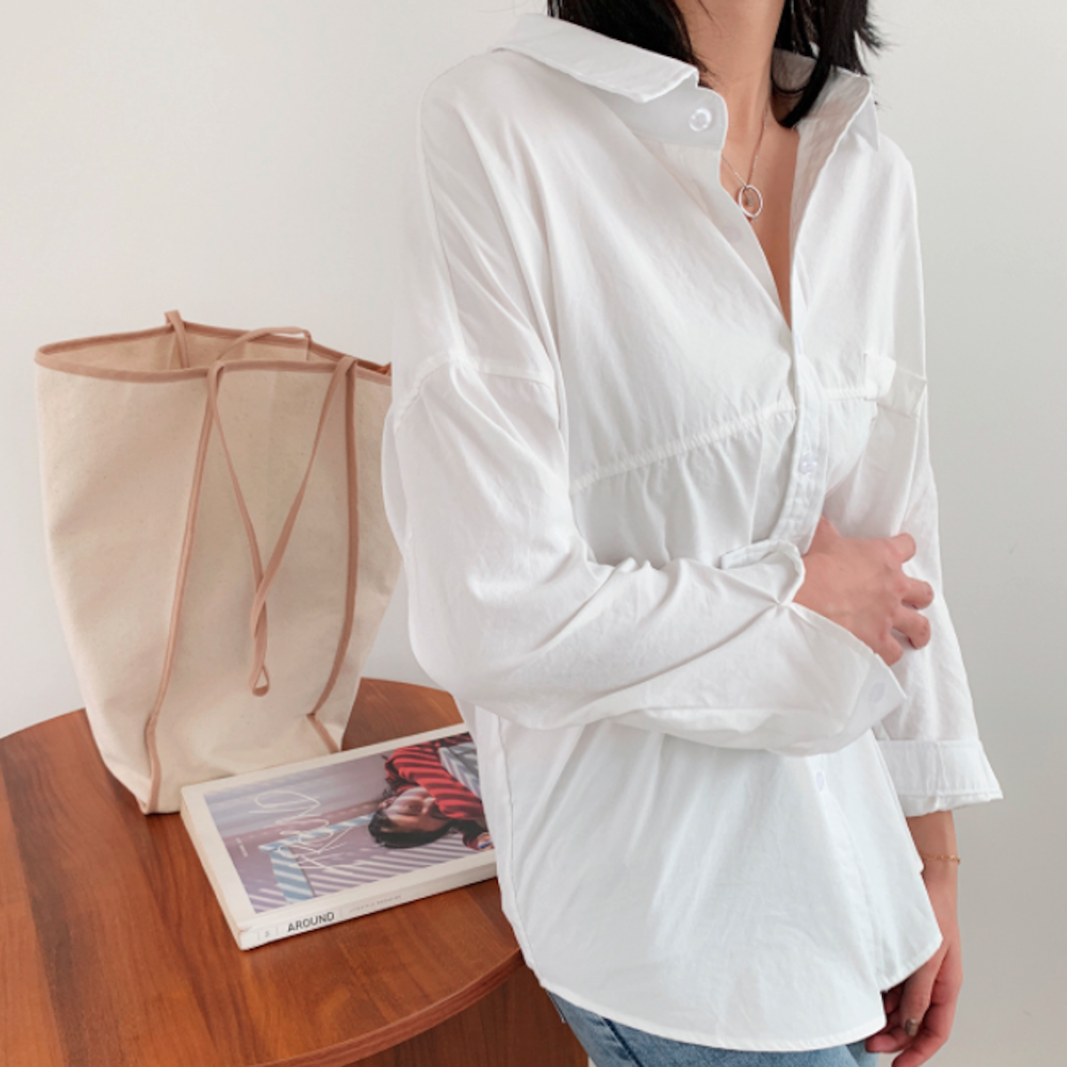 Womens Relaxed Fit Longline Shirt in white, showcasing long sleeves and loose fit design, perfect for casual street fashion.