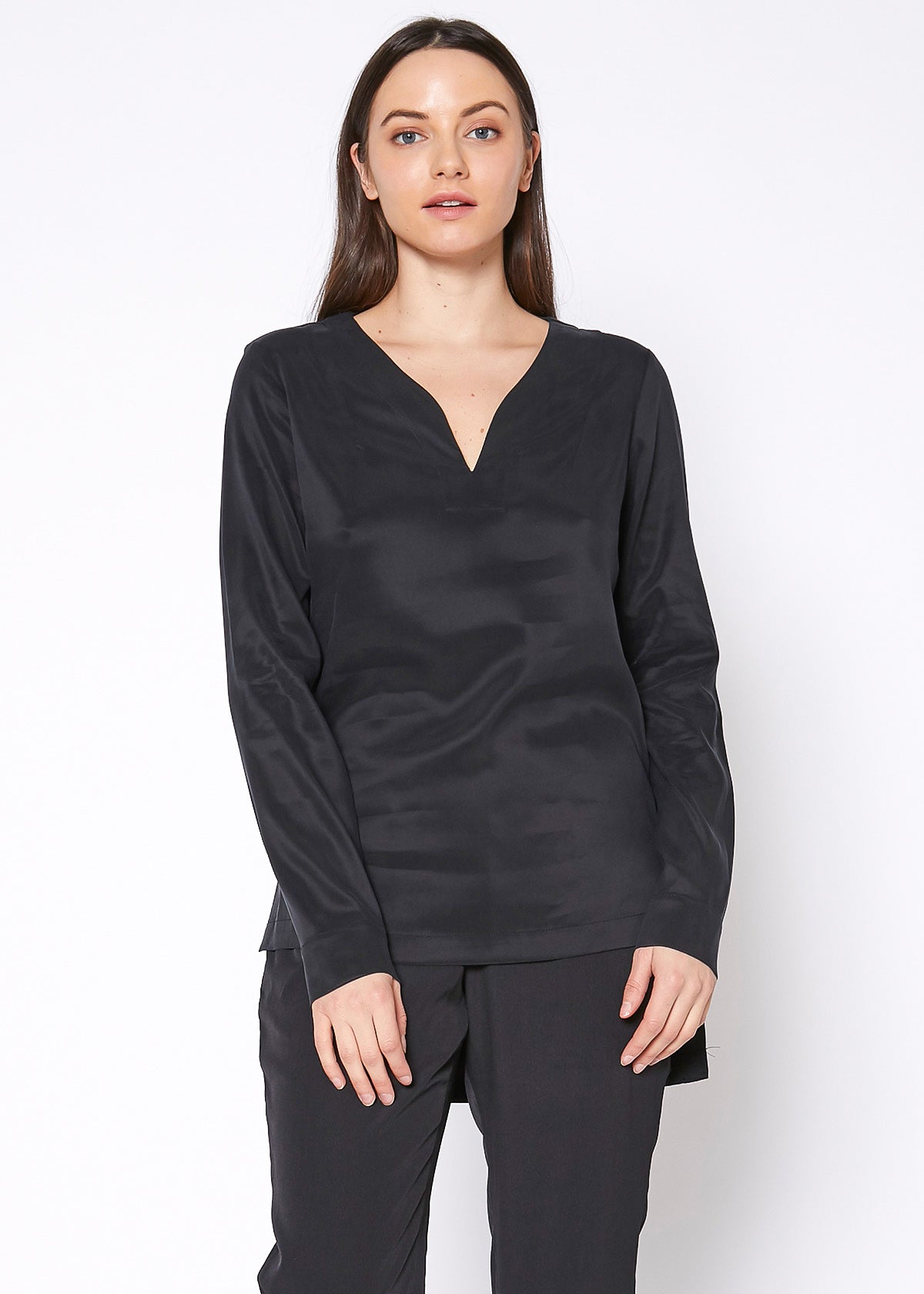 Women's Round Split Neck Hi-Lo Top featuring a stylish hi-lo hem and long sleeves with double button cuffs.