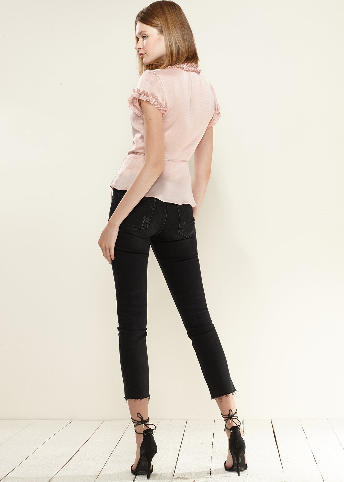 Women's Ruffle Trim Wrap Blouse featuring short sleeves and elegant ruffle details, made from soft polyester fabric.