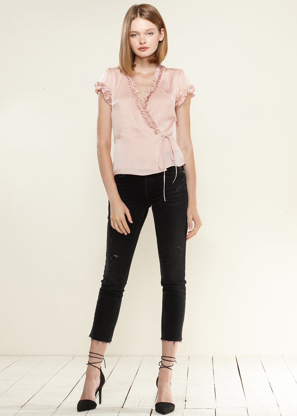 Women's Ruffle Trim Wrap Blouse featuring short sleeves and elegant ruffle details, made from soft polyester fabric.