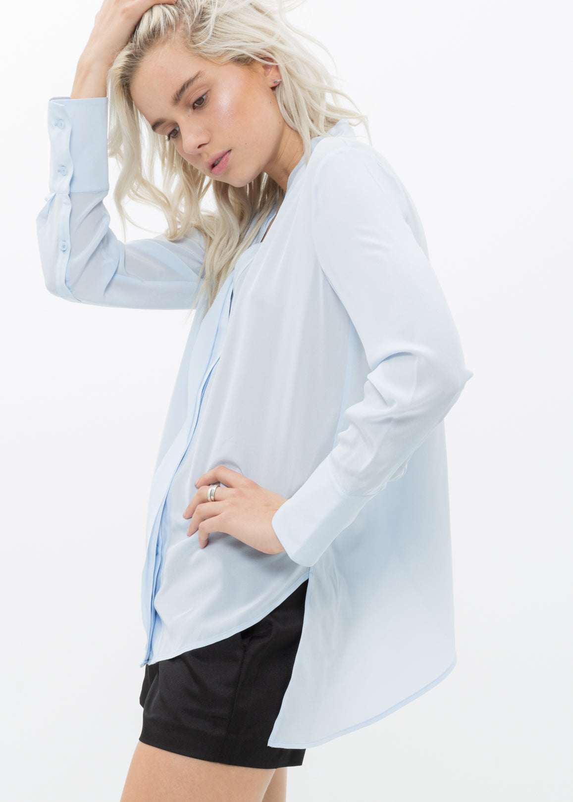 Women's Sheer Placket Hi Lo Blouse in flowy chiffon fabric with a high low hem, showcasing a stylish and elegant design.