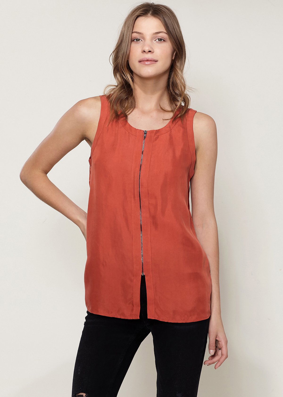 A stylish women's sleeveless top featuring a zip-up front, made from a soft cupro and viscose blend, perfect for casual wear.