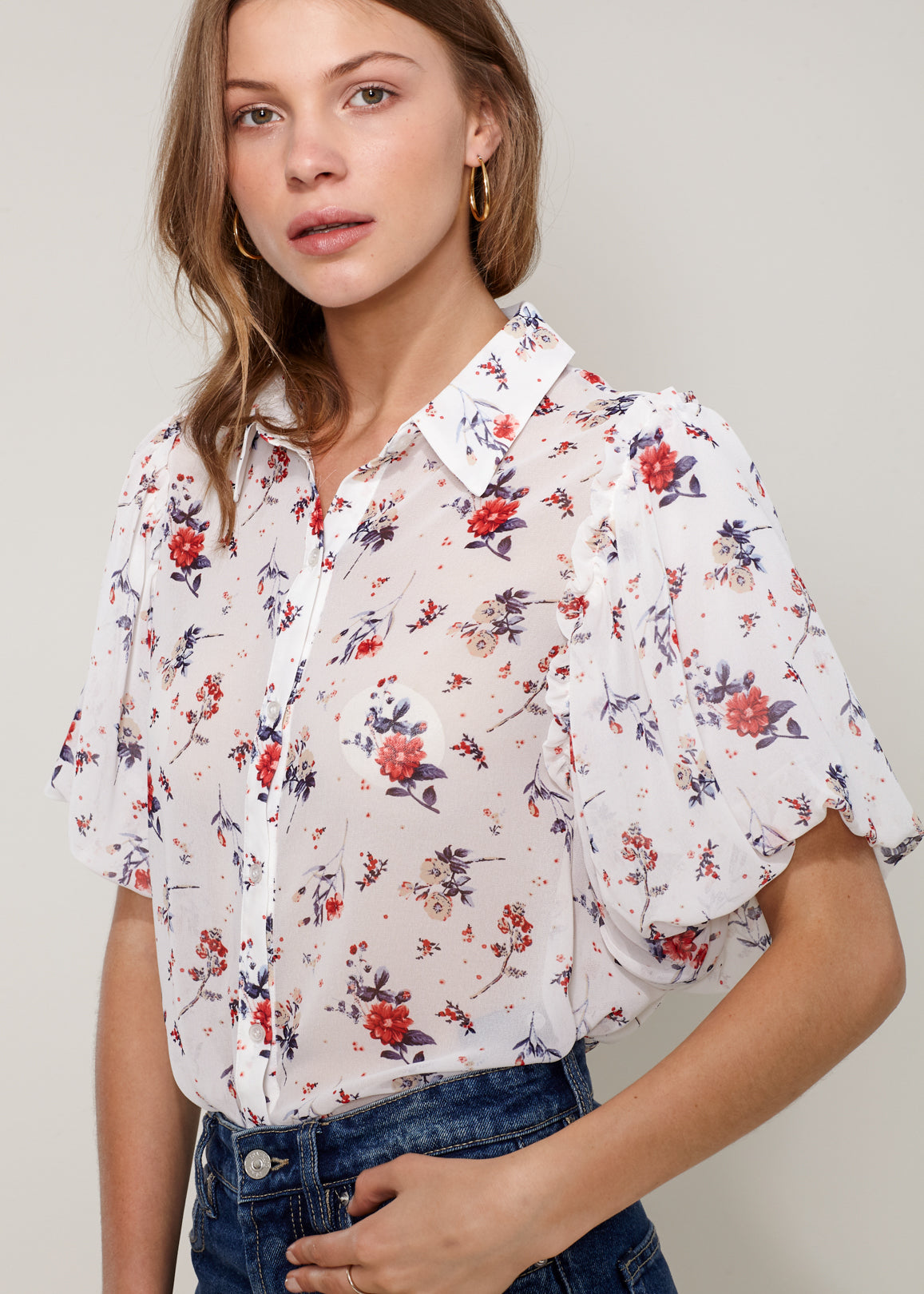 Women's Soft Flower Bell Sleeve Shirt Blouse featuring elegant bell sleeves and floral pattern, made from soft polyester fabric.