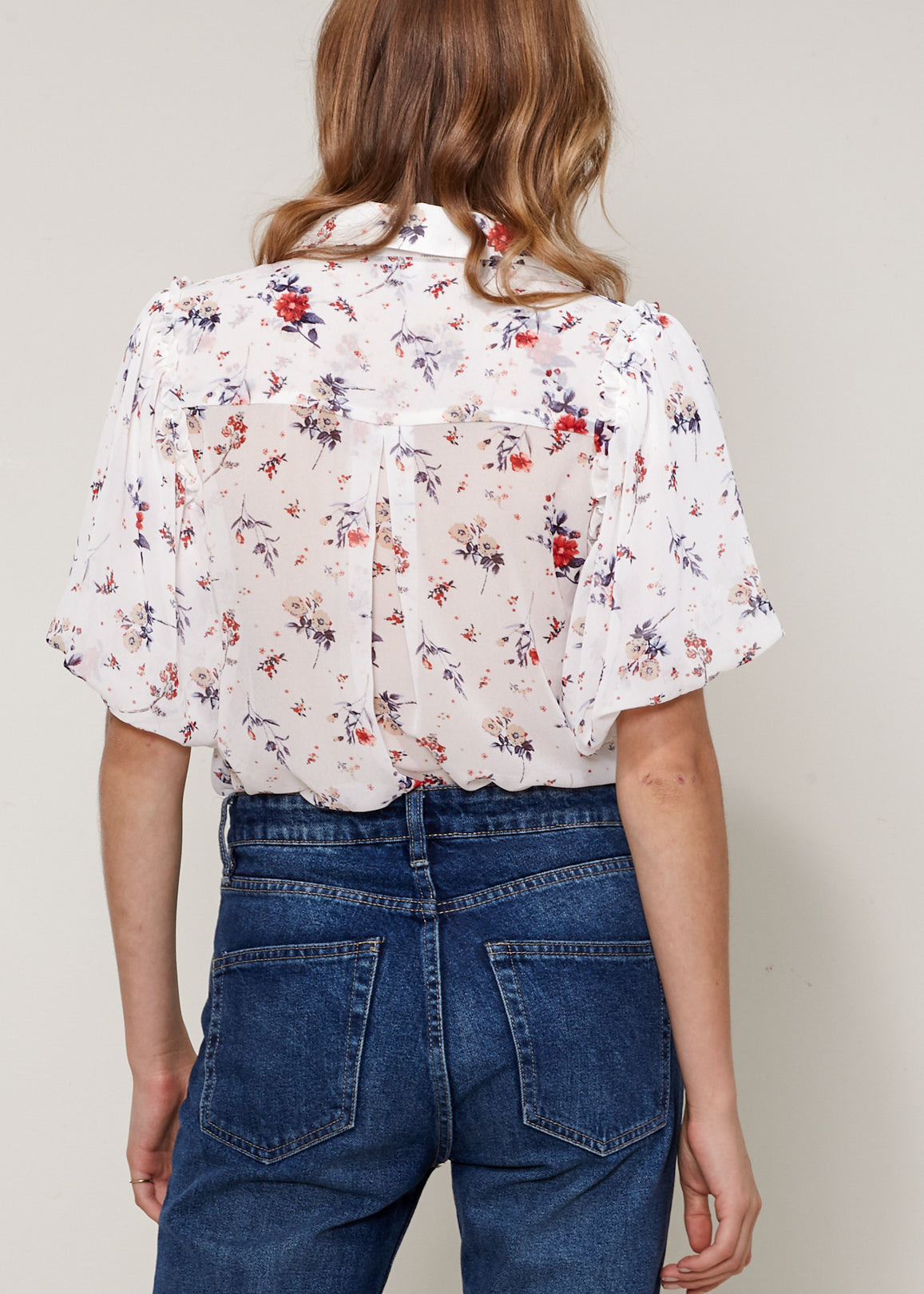 Women's Soft Flower Bell Sleeve Shirt Blouse featuring elegant bell sleeves and floral pattern, made from soft polyester fabric.