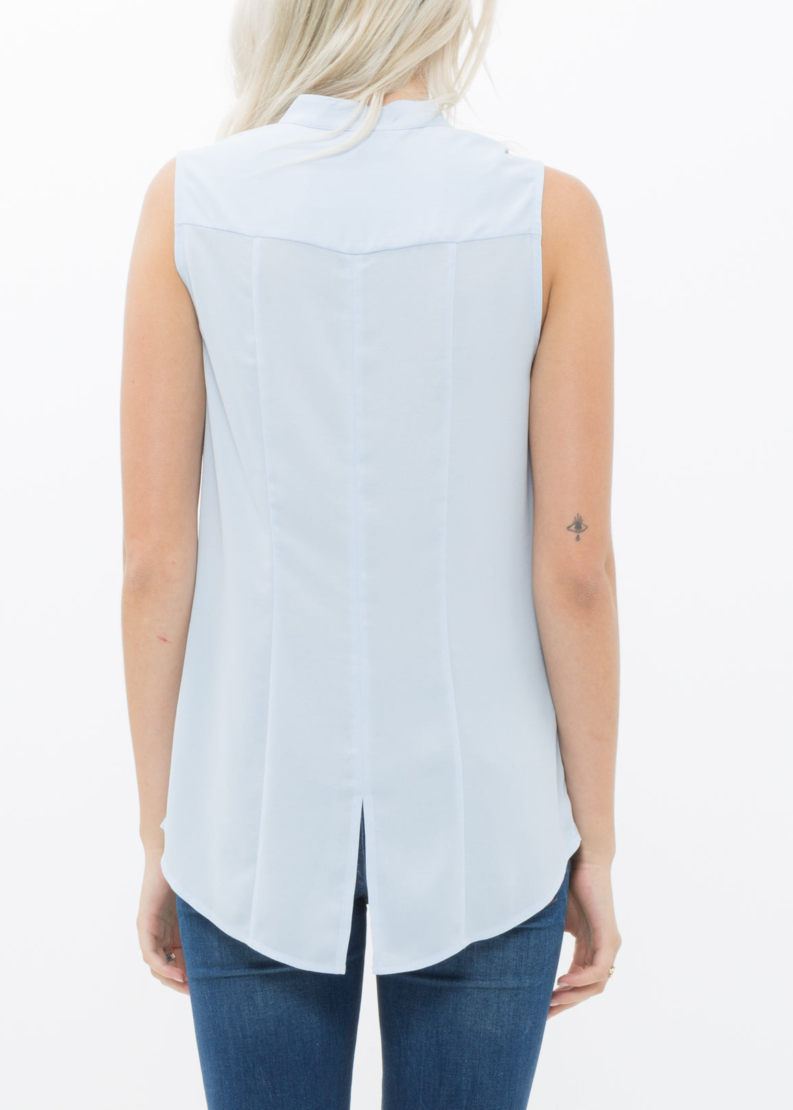 Women's stand collar sleeveless blouse in cloud blue with hidden-button fly closure and hi-lo slit hem.