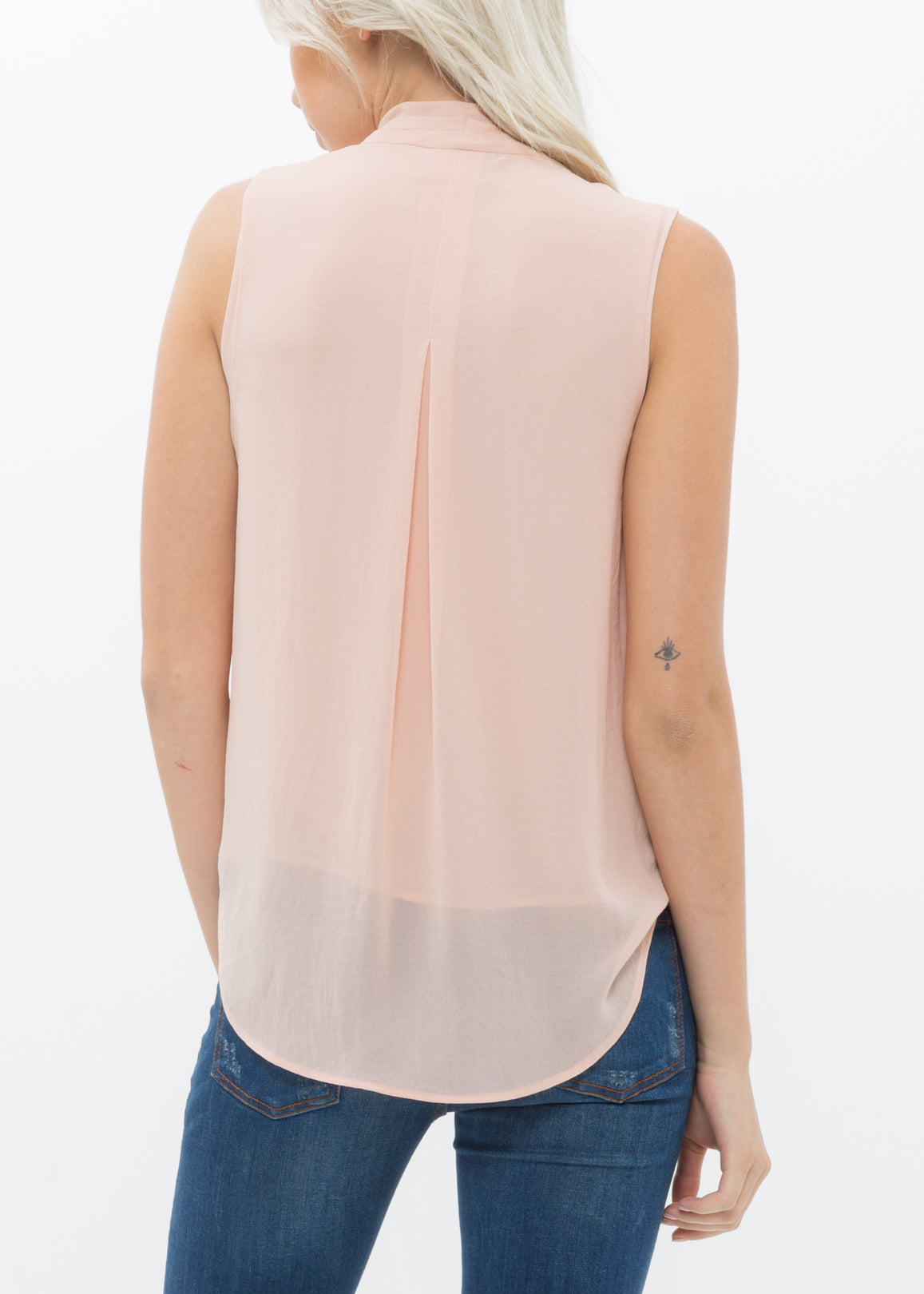 Women's Surplice Sleeveless Blouse in Blush, featuring a stylish design with button back closure and side zip.