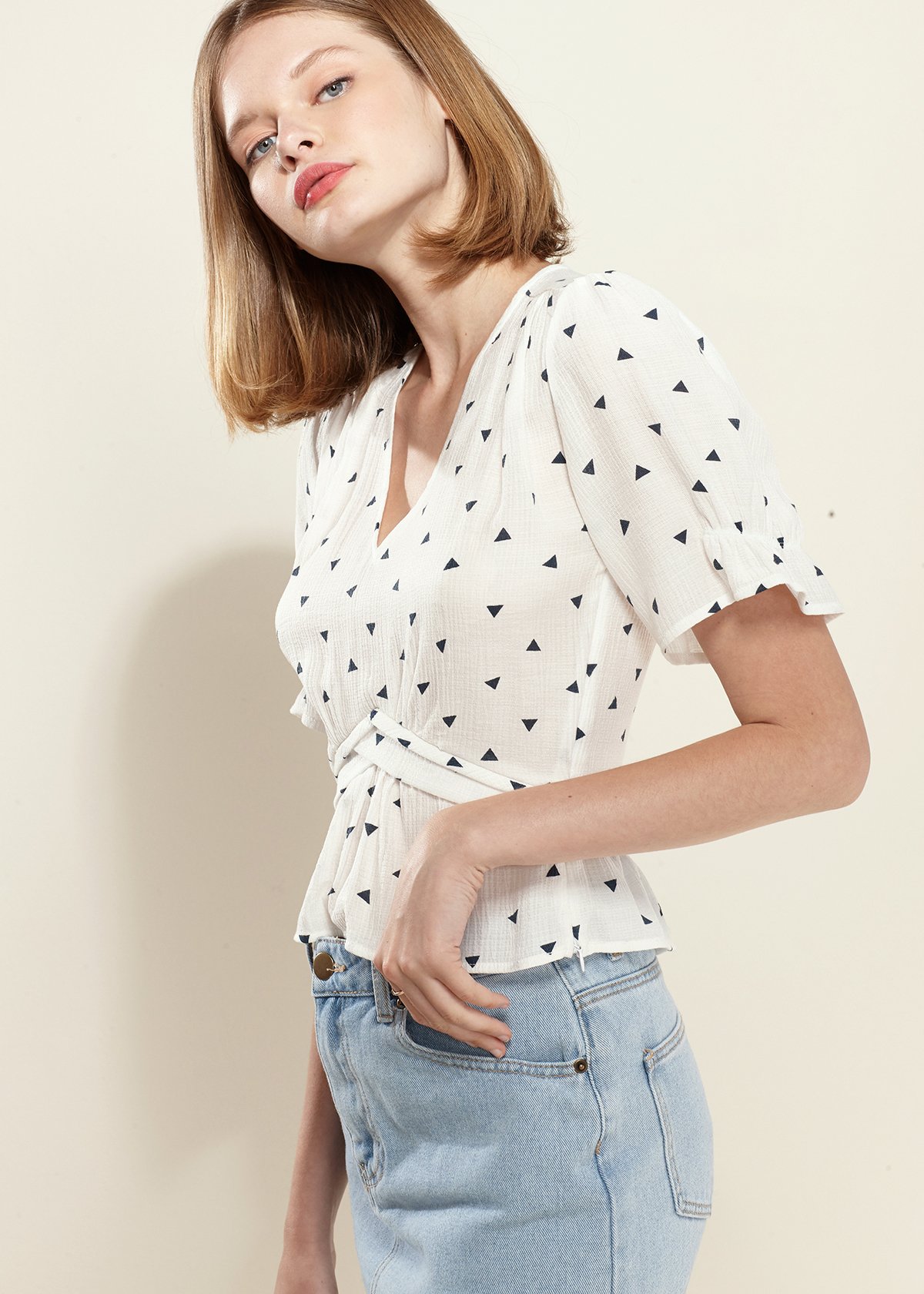 Women's Triangle Print Puff Sleeve Blouse in White with stylish triangle pattern and peplum design.