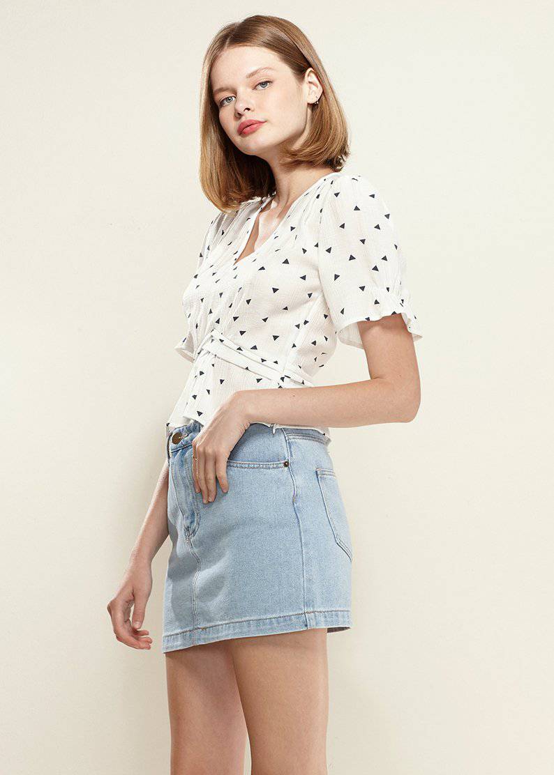 Women's Triangle Print Puff Sleeve Blouse in White with stylish triangle pattern and peplum design.