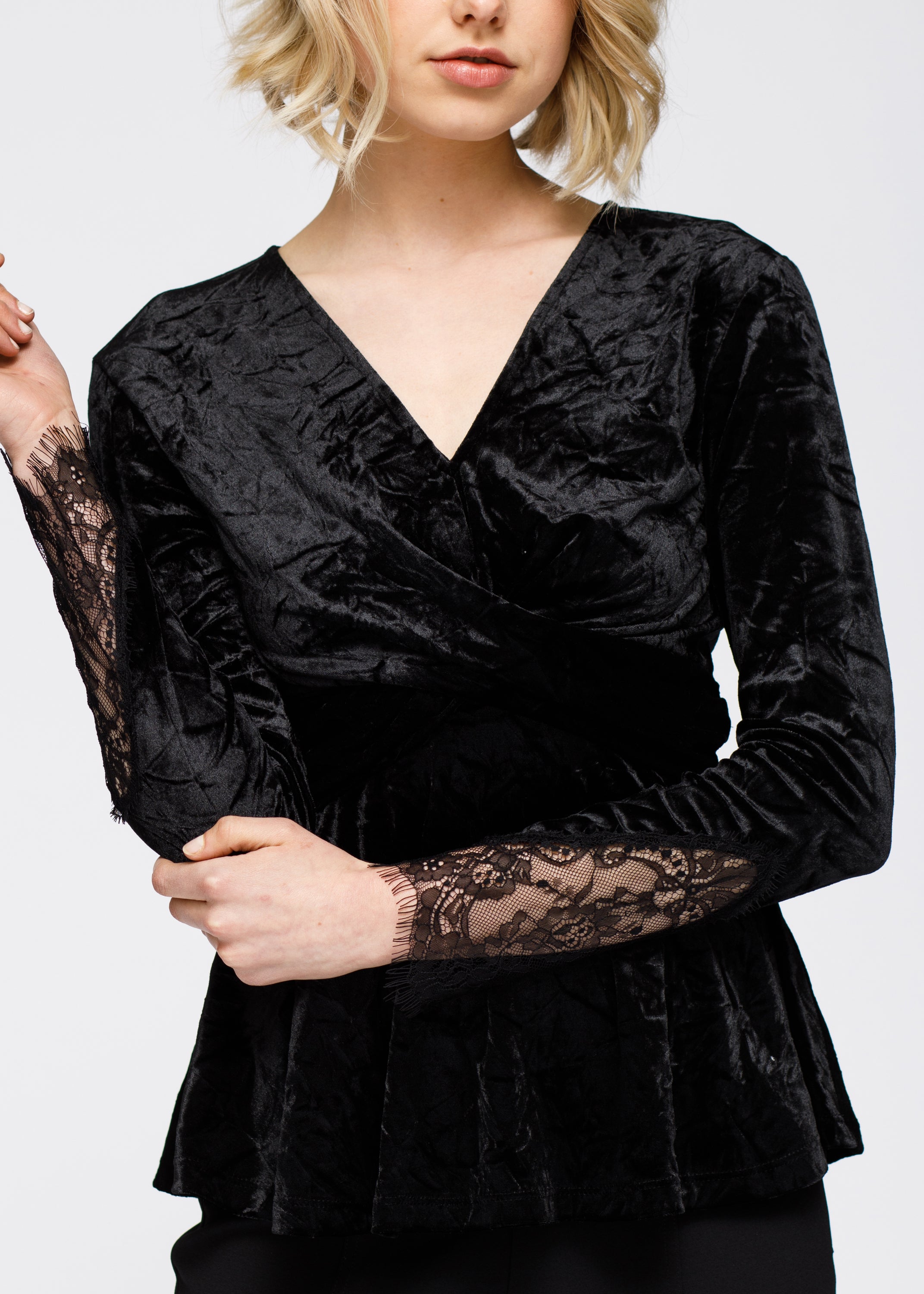 Women's Velvet Wrap Peplum Top featuring lace inset sleeves and a flattering wrap front design in a rich velvet fabric.