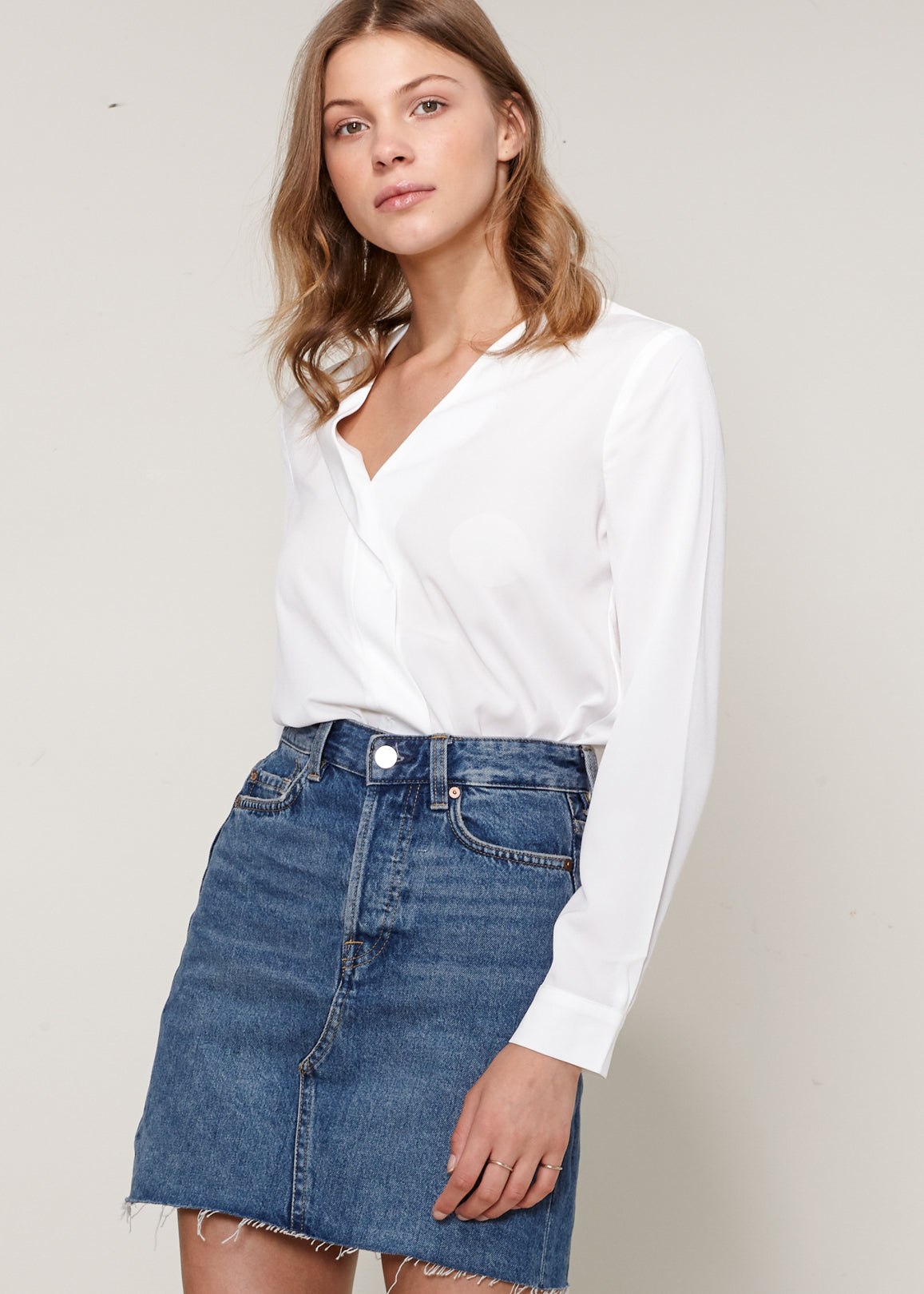 A stylish Women's V-neck Blouse made from 100% polyester, showcasing its elegant neckline and lightweight fabric.