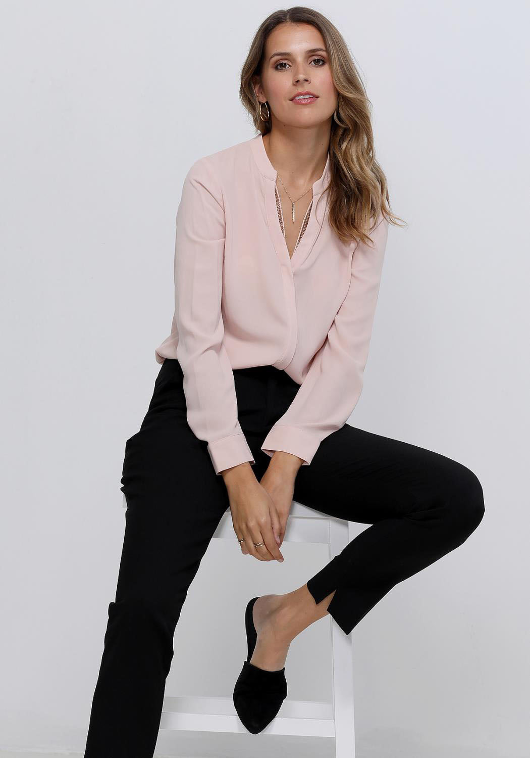 Women's V-Neck Essential Blouse with long sleeves, embellished neck, and round hem in a stylish design.