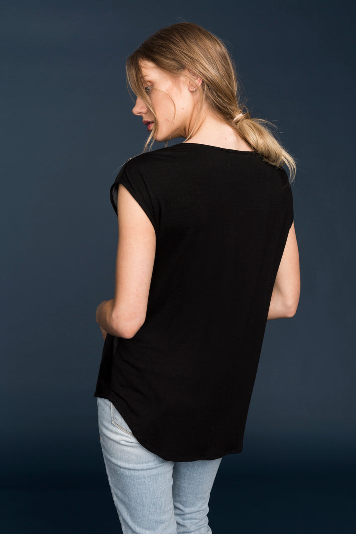 A stylish Women's Zip Shoulder Leather Front Top featuring a luxurious leather front and unique zip shoulder design, perfect for versatile fashion.