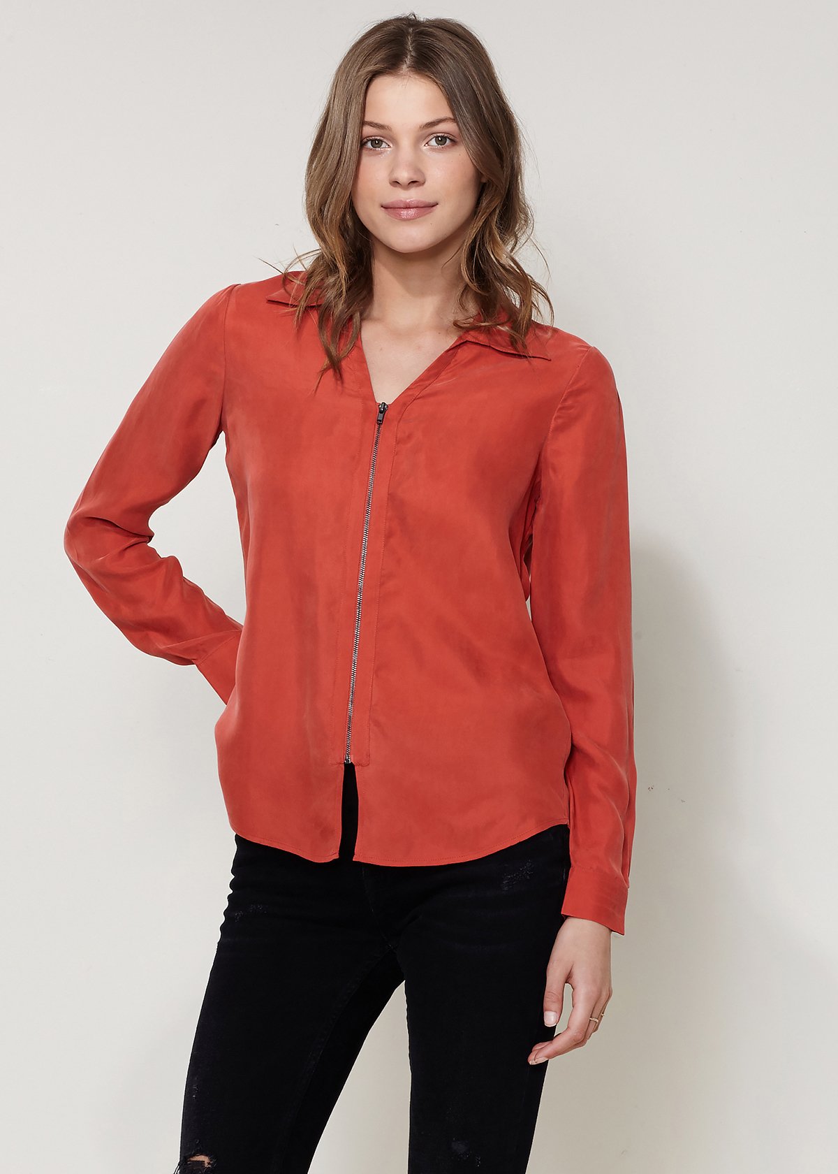 Women's zip-up shirt blouse with standard collar, hi-lo hem, and long sleeves with button cuffs, made from soft Cupro and Viscose blend.