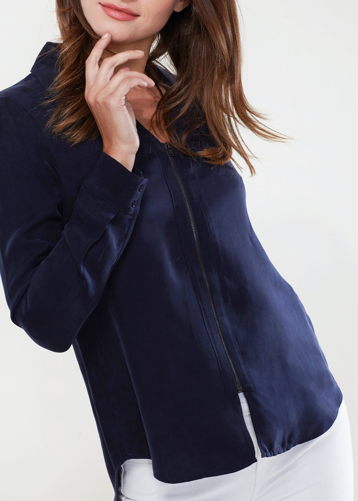 Women's zip-up shirt blouse with standard collar, hi-lo hem, and long sleeves with button cuffs, made from soft Cupro and Viscose blend.