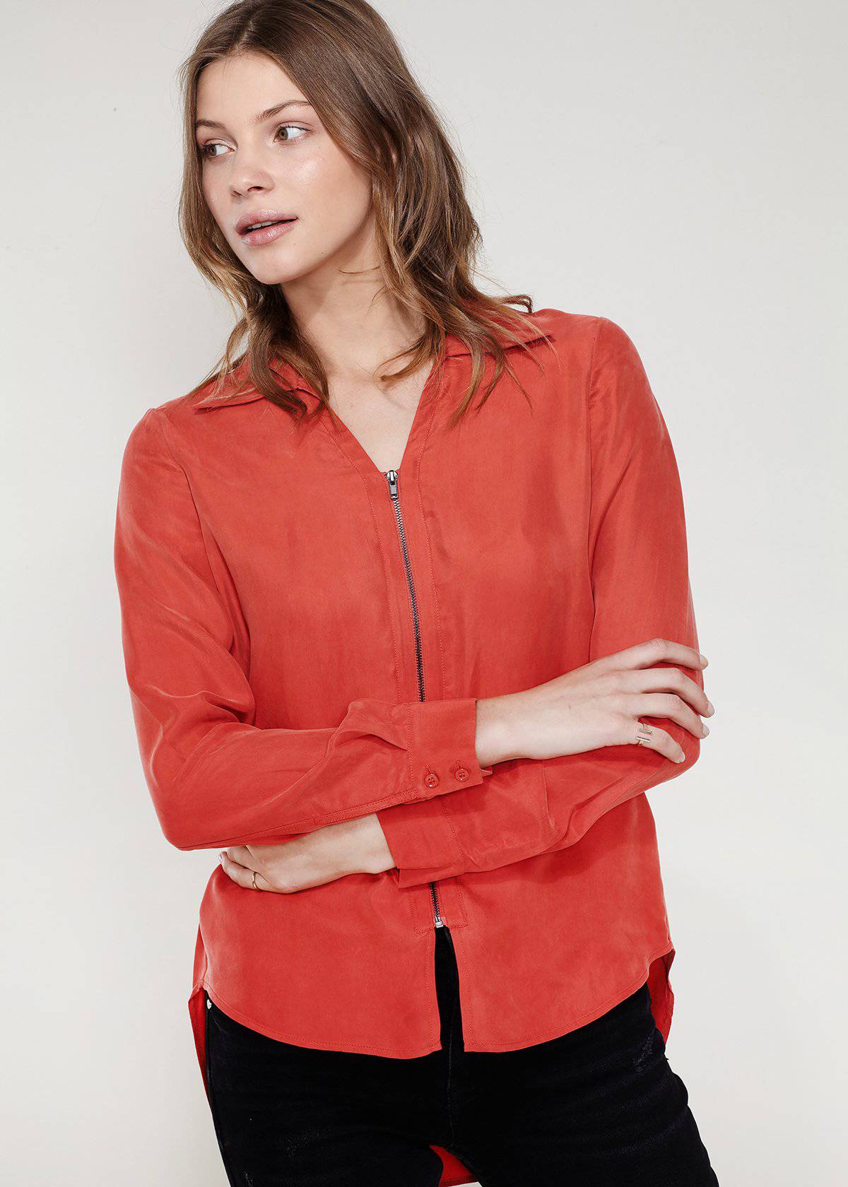 Women's zip-up shirt blouse with standard collar, hi-lo hem, and long sleeves with button cuffs, made from soft Cupro and Viscose blend.