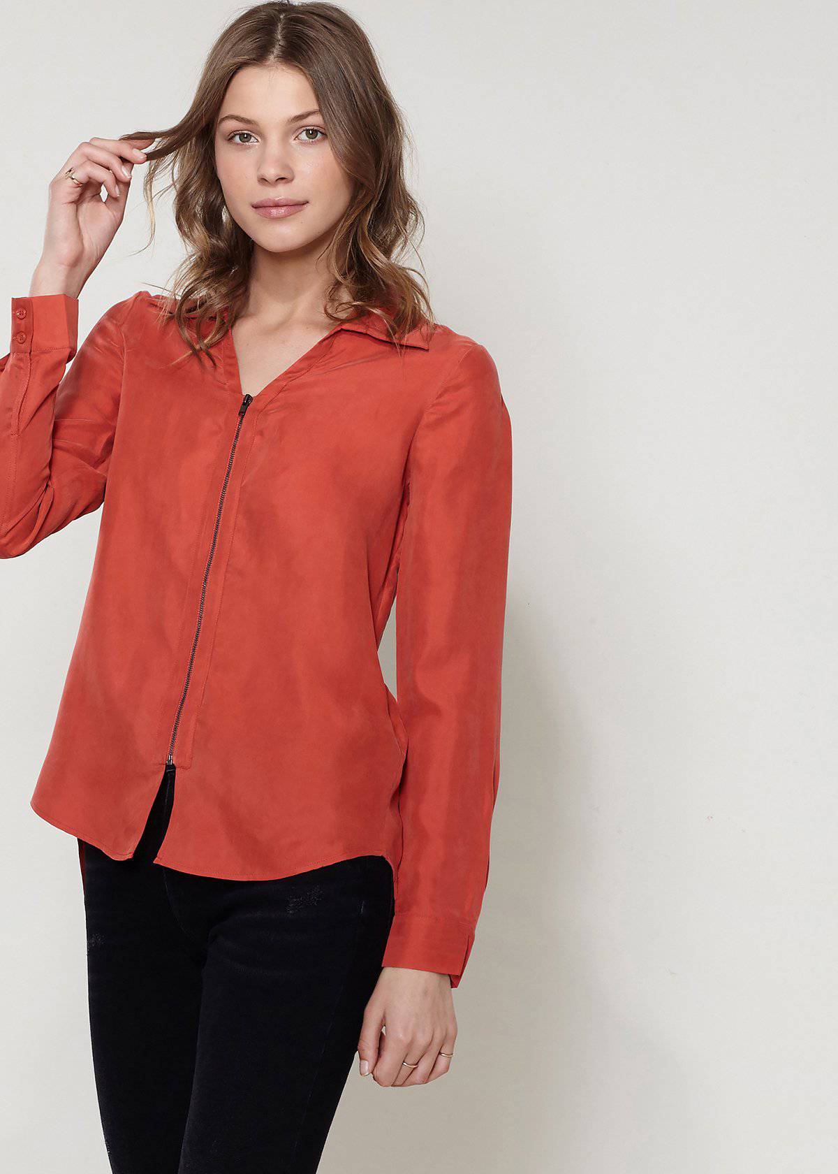 Women's zip-up shirt blouse with standard collar, hi-lo hem, and long sleeves with button cuffs, made from soft Cupro and Viscose blend.