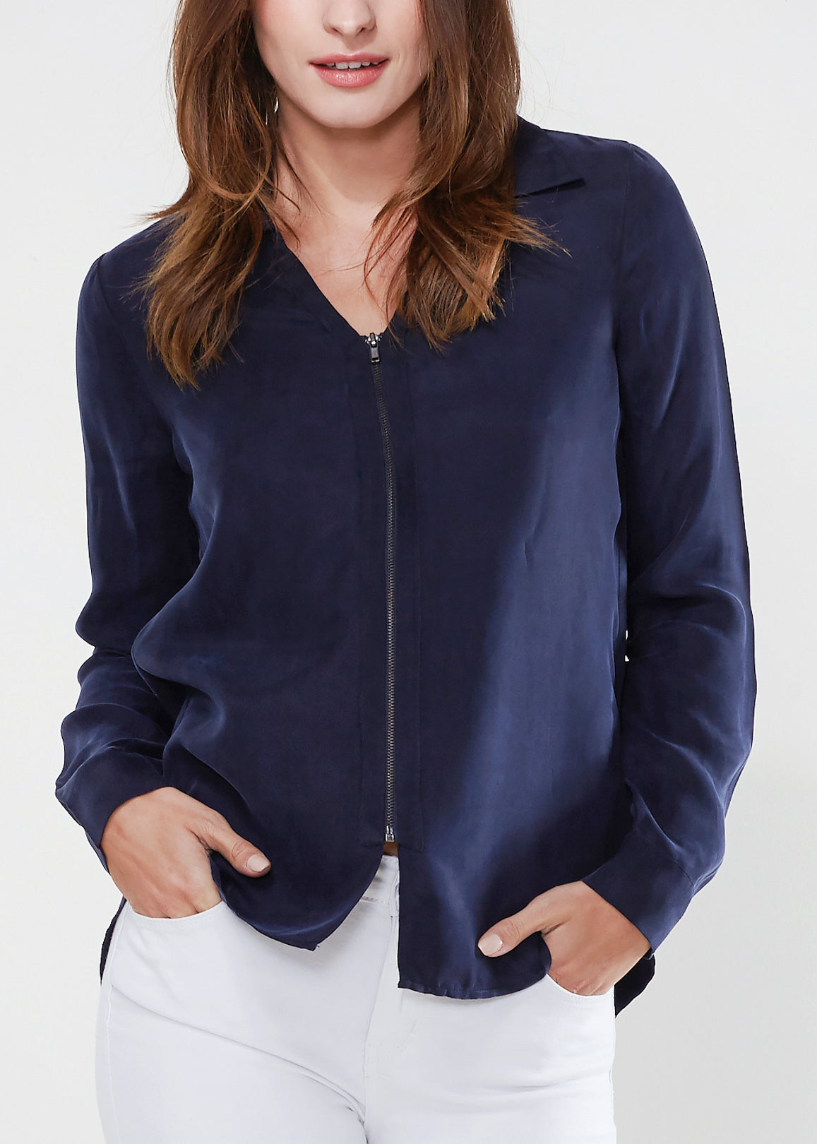 Women's zip-up shirt blouse with standard collar, hi-lo hem, and long sleeves with button cuffs, made from soft Cupro and Viscose blend.