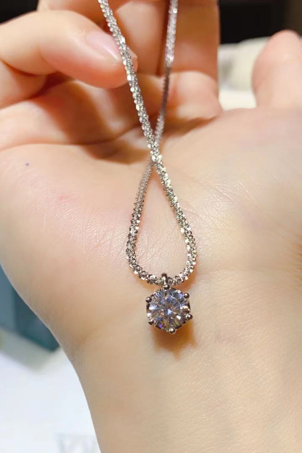 Elegant 1 Carat Moissanite Necklace in 925 Sterling Silver with matching gift box, showcasing modern design and sparkling stones.