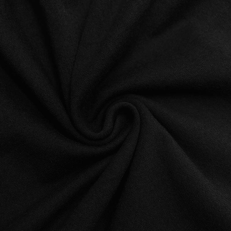 1/2 yard of black cotton jersey knit fabric, soft and stretchy, ideal for sewing projects.