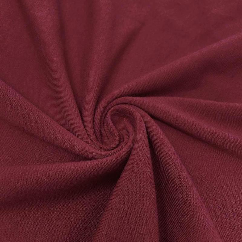 Burgundy cotton jersey knit fabric, soft and stretchy, ideal for sewing projects.