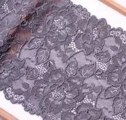 1/2 yard of grey double edge stretch floral lace, showcasing intricate floral patterns and a soft mesh texture.