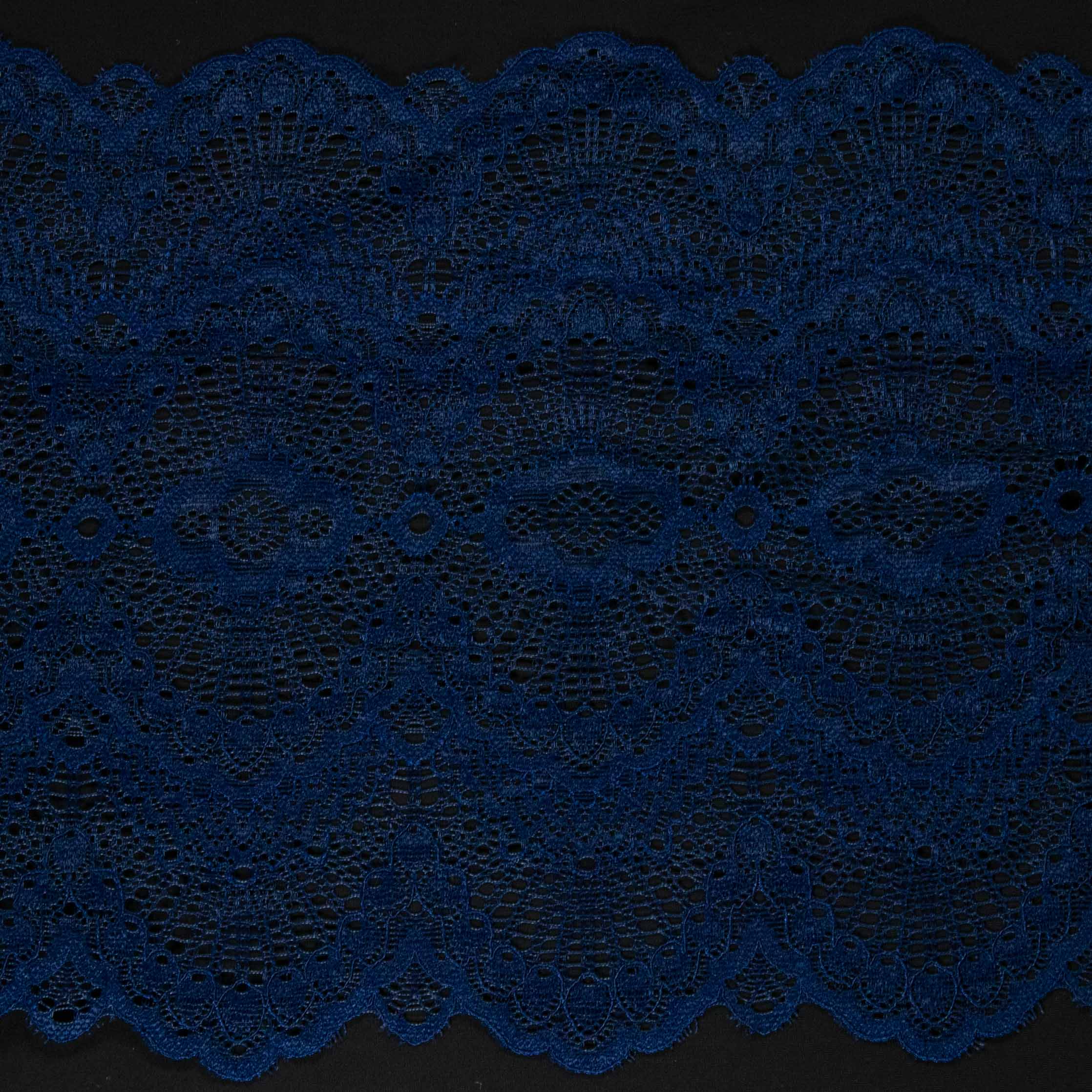 1/2 yard of blue double edge stretch scallop lace, showcasing intricate embroidered mesh design and scalloped edges.